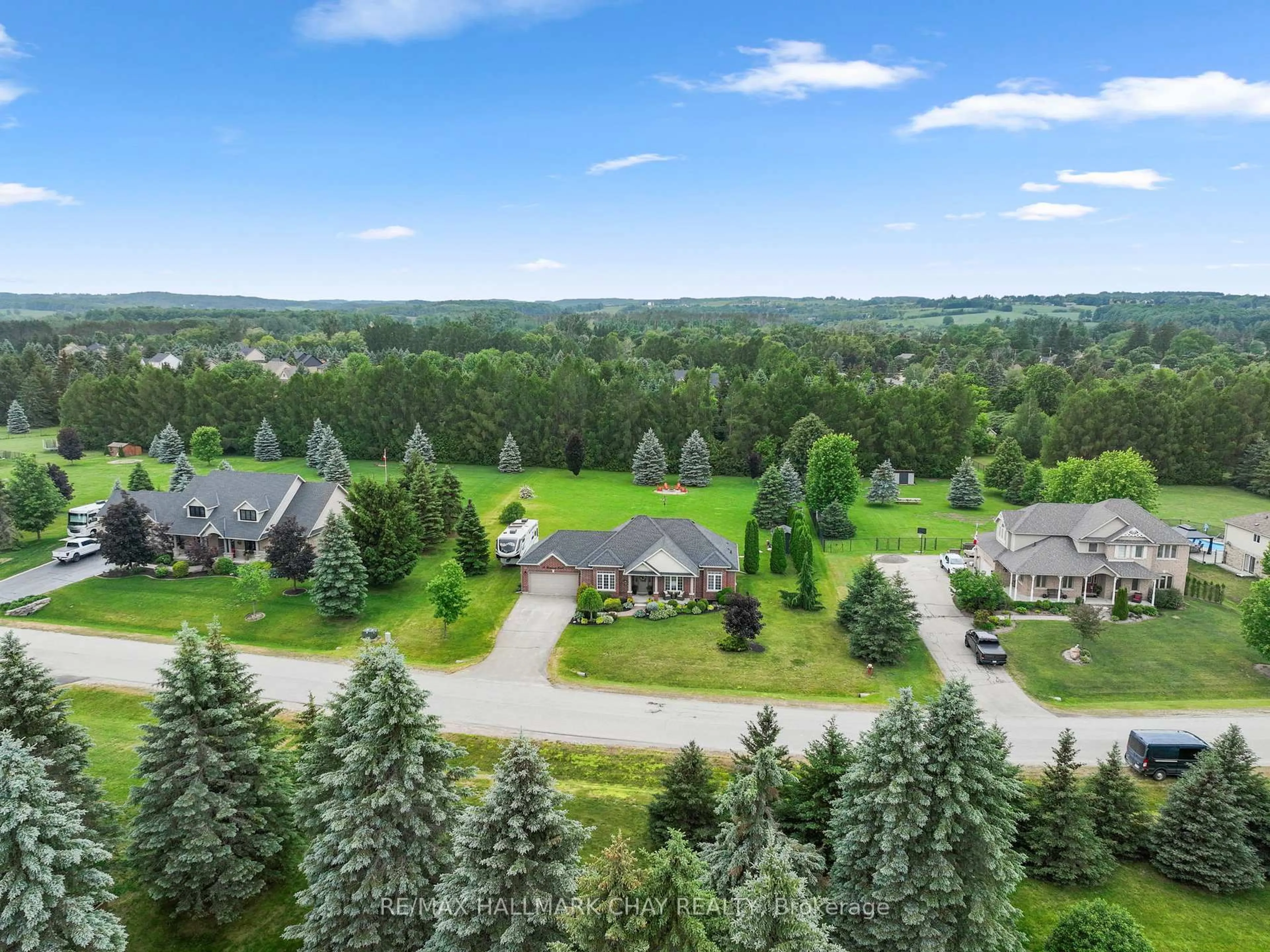 A pic from outside/outdoor area/front of a property/back of a property/a pic from drone, unknown for 12 Thomson Tr, Mulmur Ontario L9V 3J1