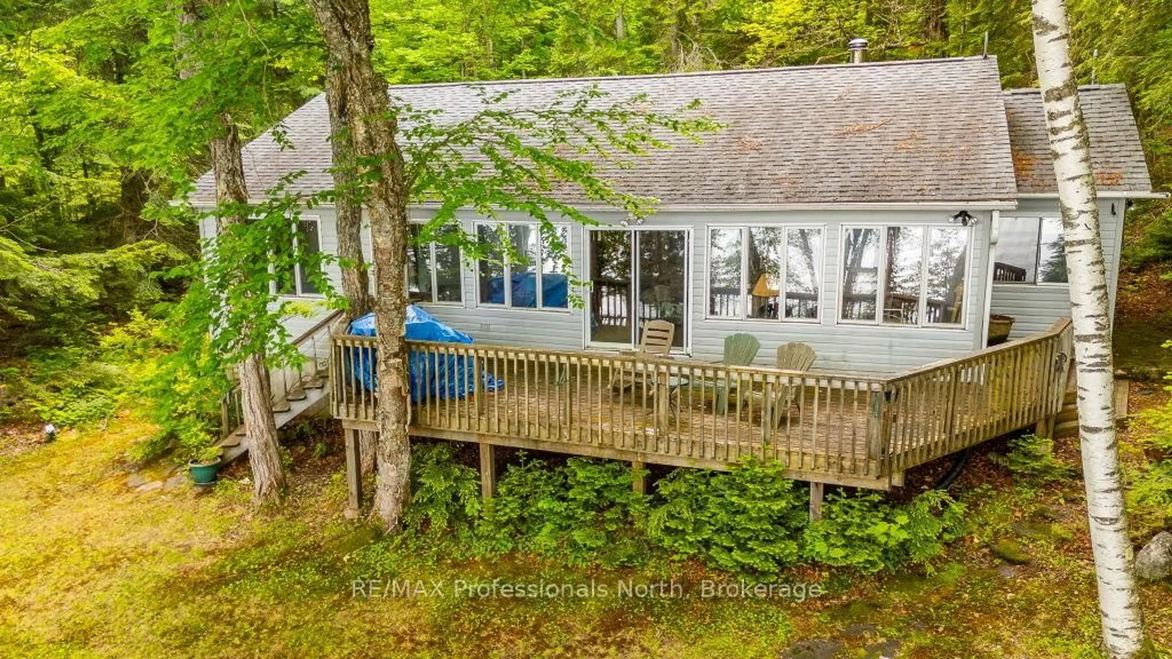 A pic from outside/outdoor area/front of a property/back of a property/a pic from drone, water/lake/river/ocean view for 1016 Laferle Crt, Dysart et al Ontario K0M 1S0