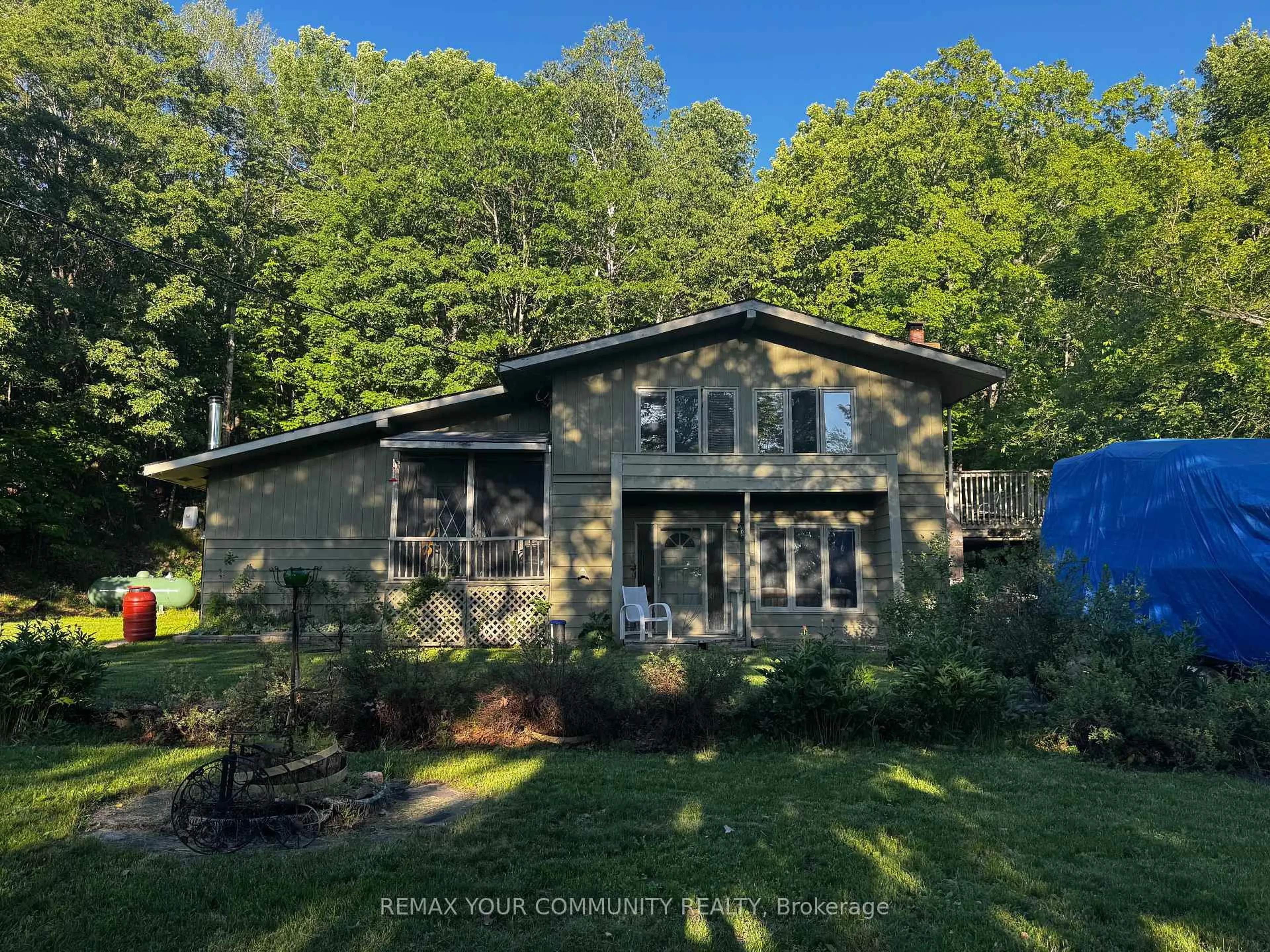 A pic from outside/outdoor area/front of a property/back of a property/a pic from drone, water/lake/river/ocean view for 1025 Meadowview Rd, Dysart et al Ontario K0M 1S0