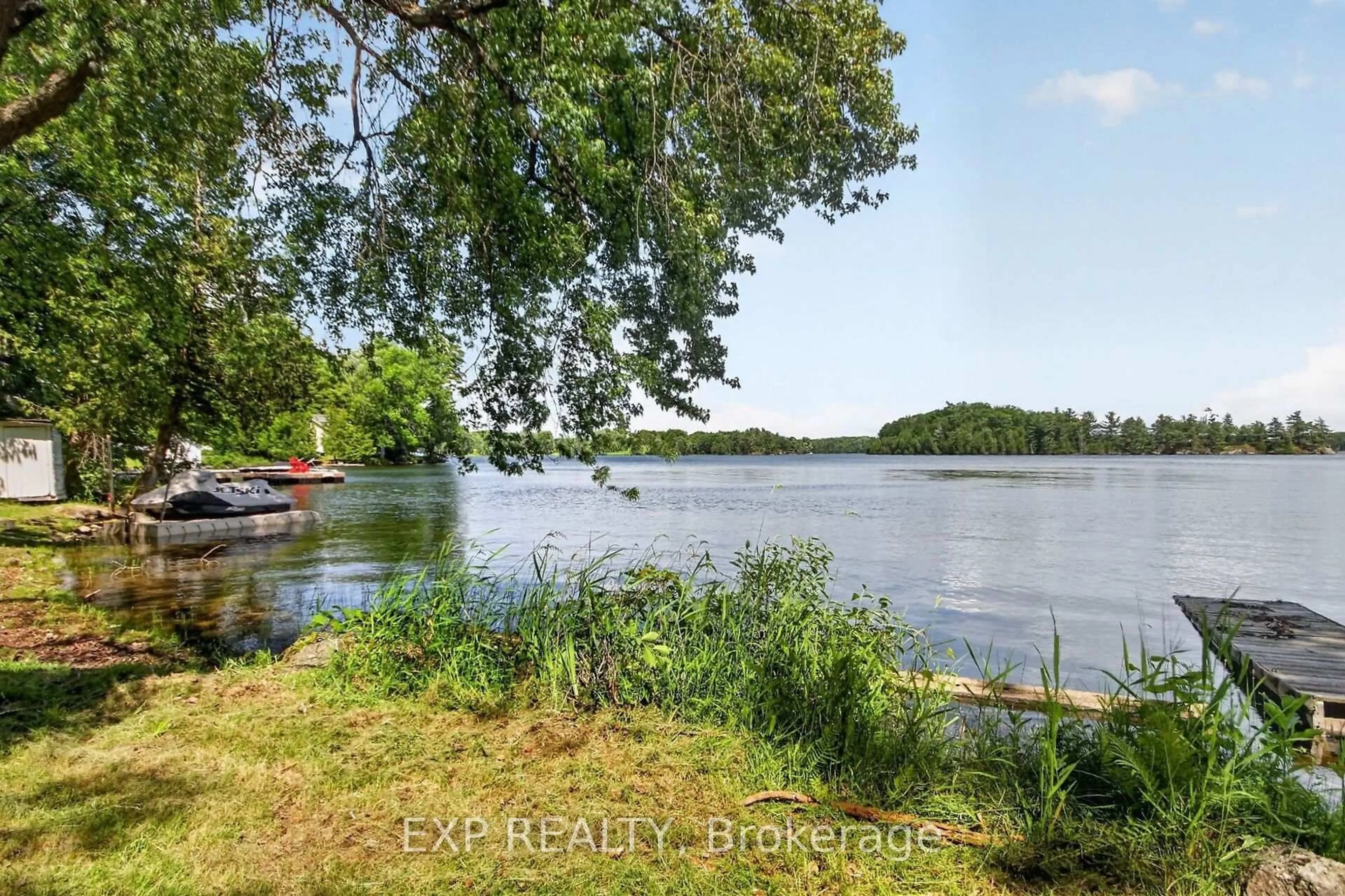 A pic from outside/outdoor area/front of a property/back of a property/a pic from drone, water/lake/river/ocean view for 61 Cedar Haven Lane, Tichborne Ontario K0H 2V0