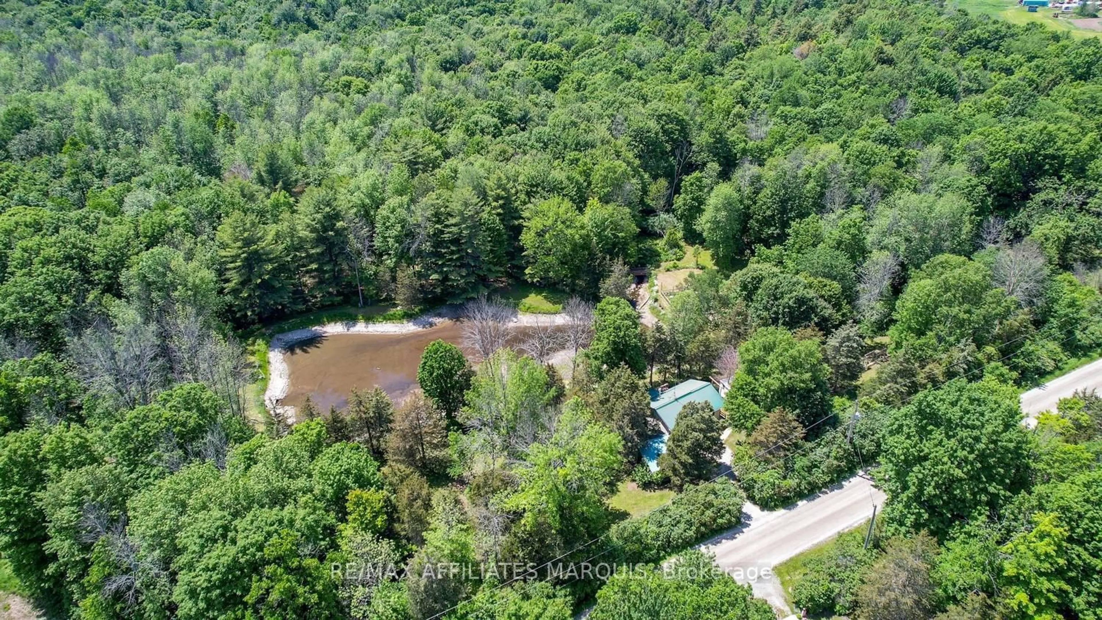 A pic from outside/outdoor area/front of a property/back of a property/a pic from drone, forest/trees view for 100 Coons Rd, Rideau Lakes Ontario K0G 1E0