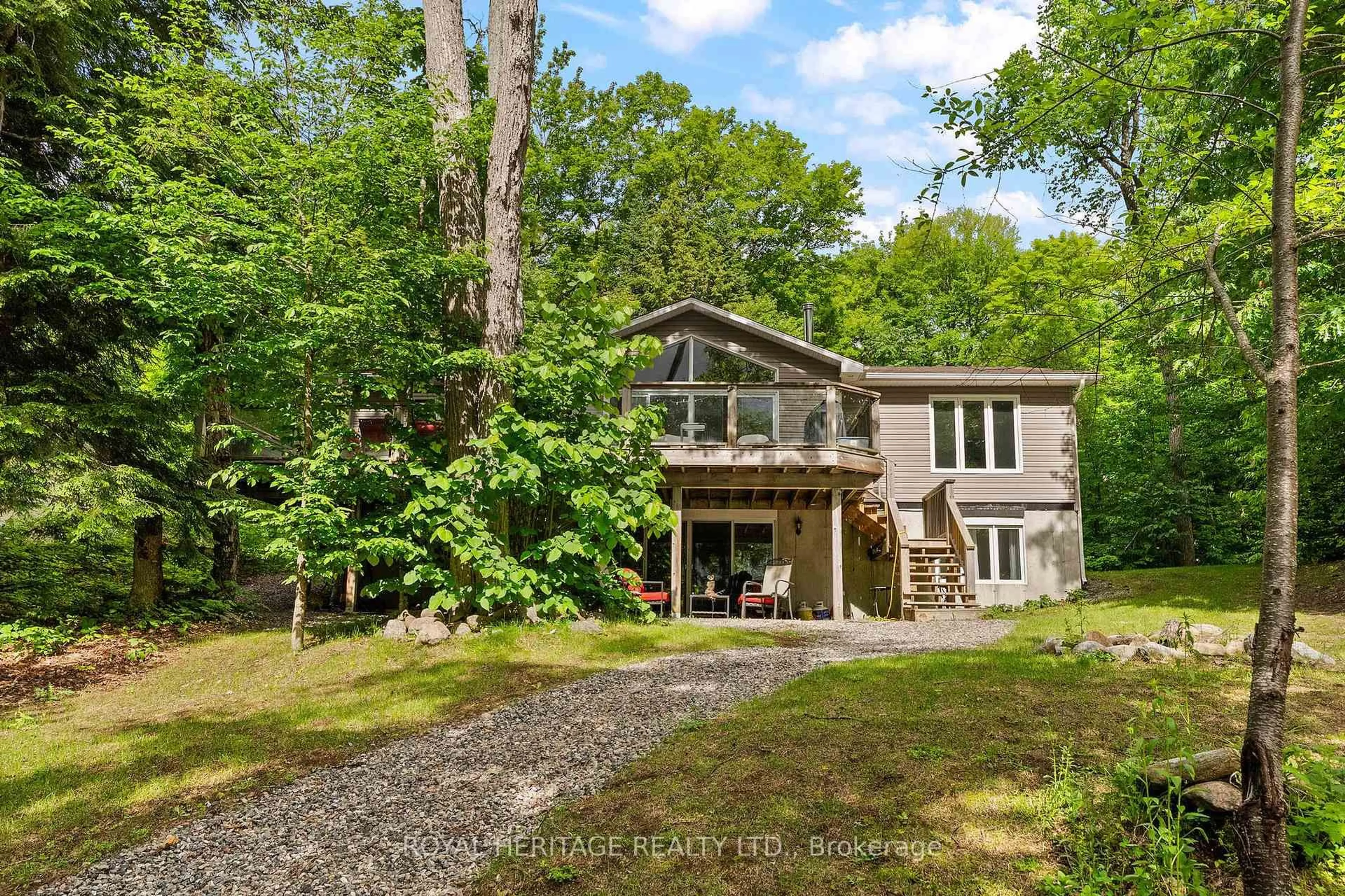 A pic from outside/outdoor area/front of a property/back of a property/a pic from drone, water/lake/river/ocean view for 1160 Minnow Dr, Dysart et al Ontario K0M 1S0