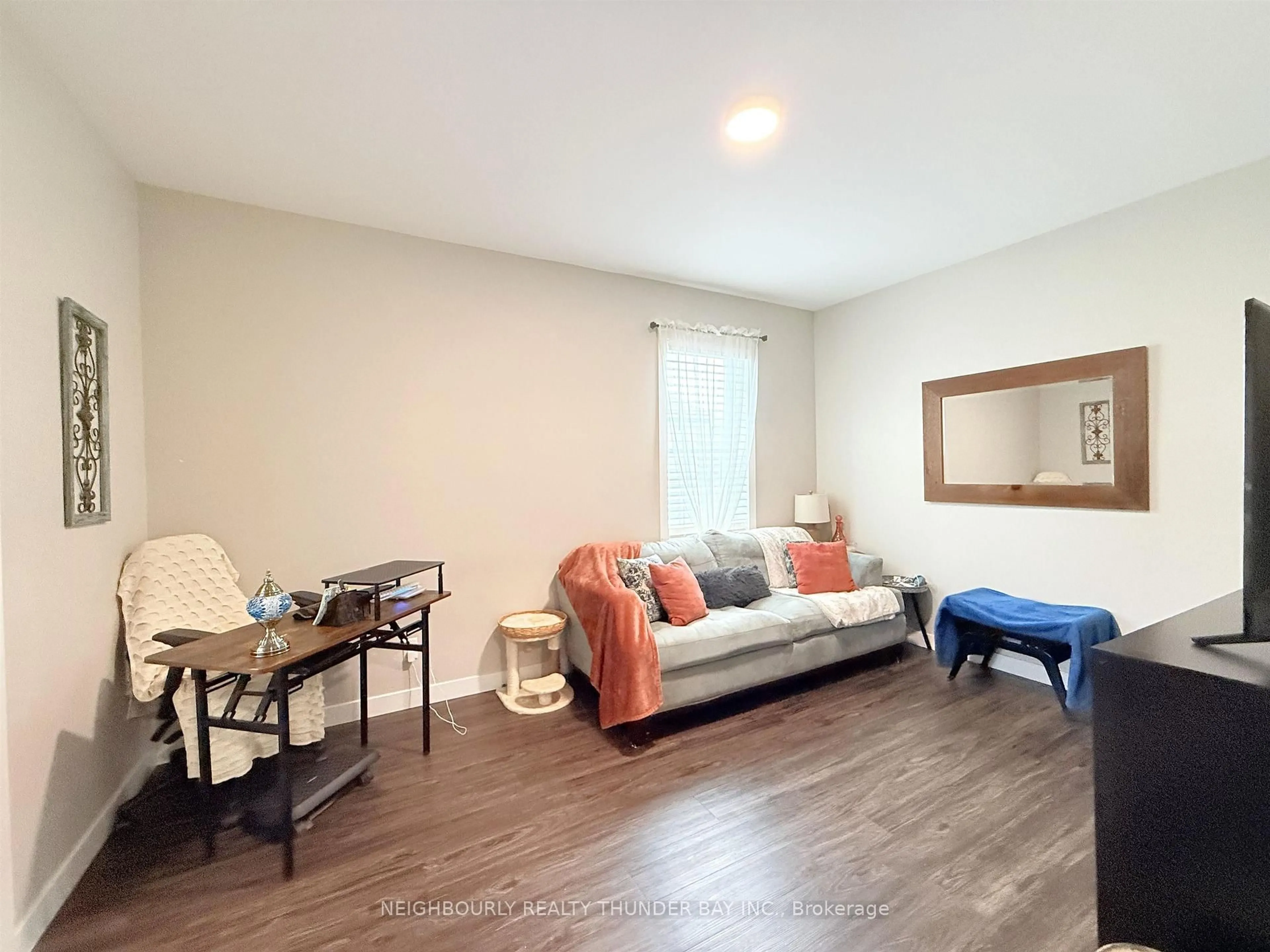 Living room with furniture, wood/laminate floor for 205 Marks St, Thunder Bay Ontario P7C 4E9