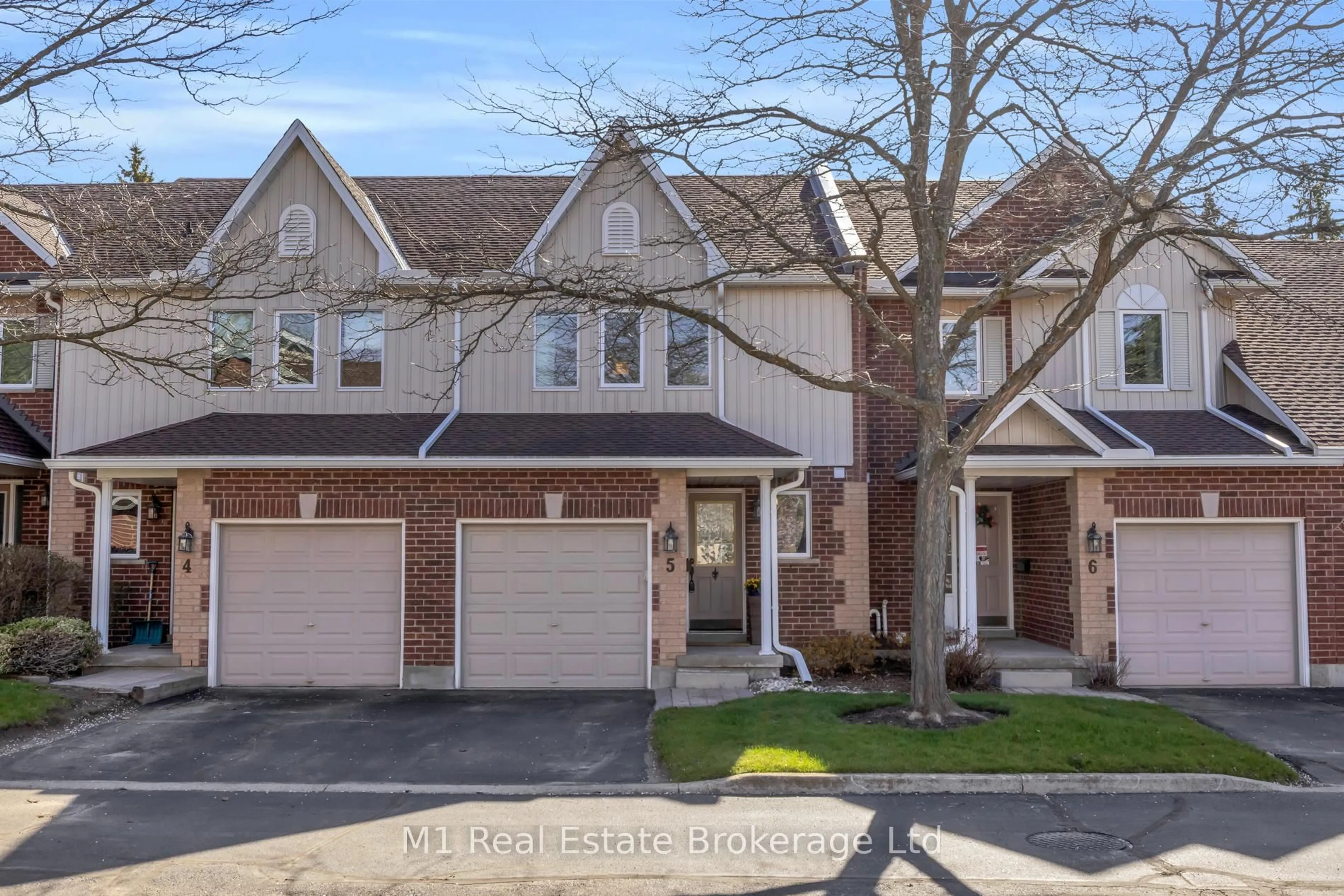 Home with brick exterior material, street for 39 Ptarmigan Dr #5, Guelph Ontario N1C 1E8