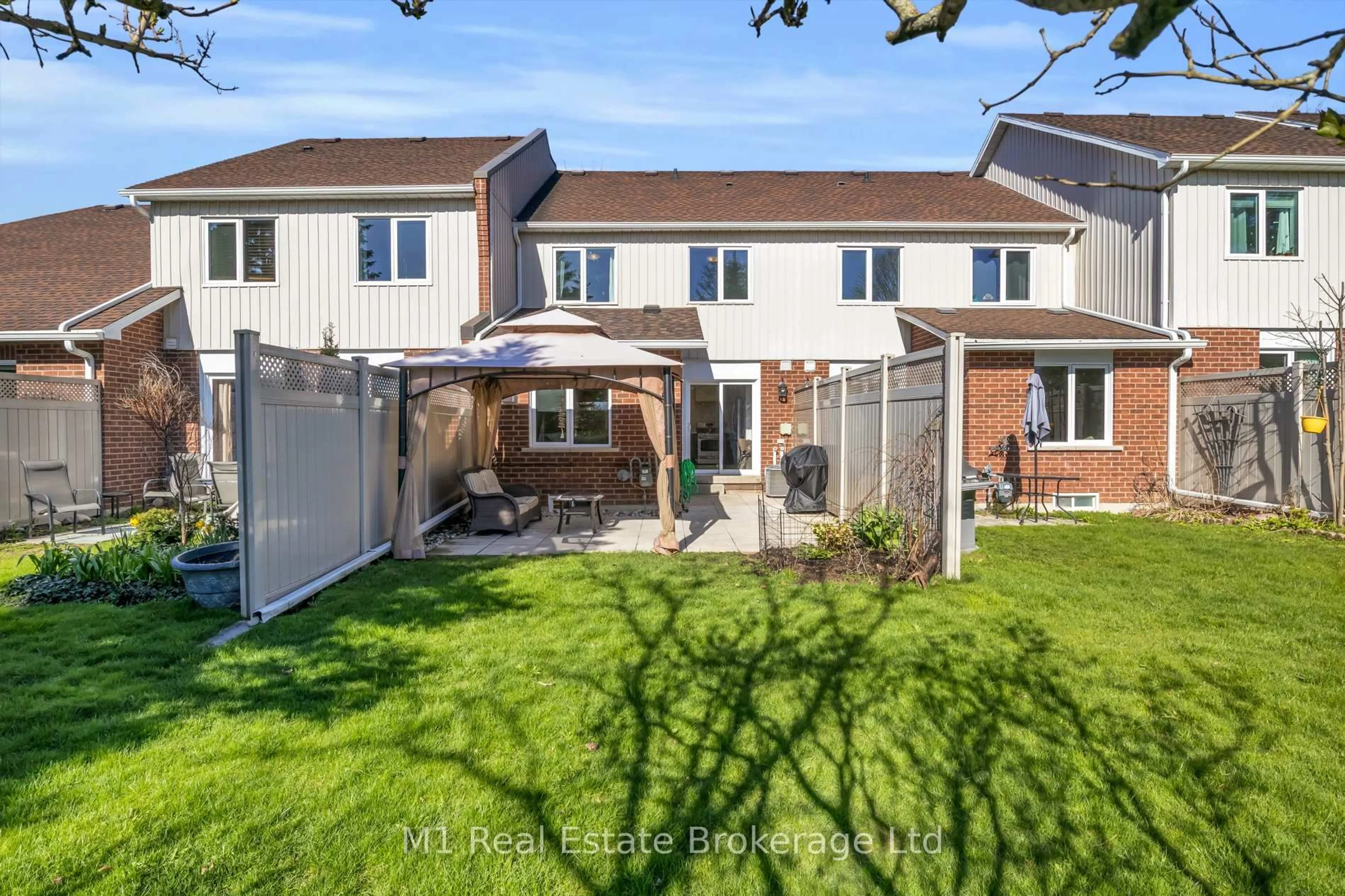 A pic from outside/outdoor area/front of a property/back of a property/a pic from drone, street for 39 Ptarmigan Dr #5, Guelph Ontario N1C 1E8