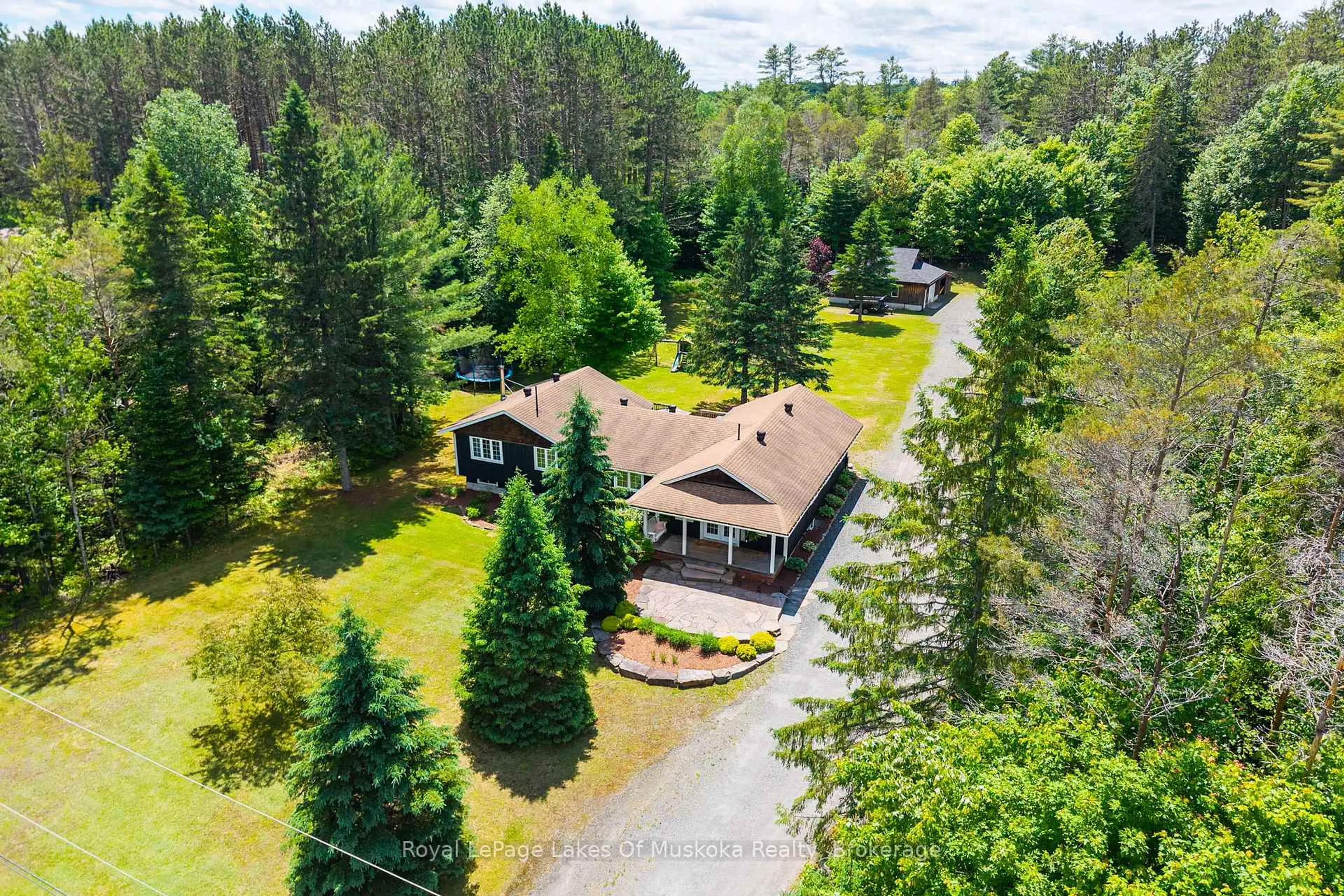 A pic from outside/outdoor area/front of a property/back of a property/a pic from drone, forest/trees view for 764 Fowlers Rd, Huntsville Ontario P1H 2N5