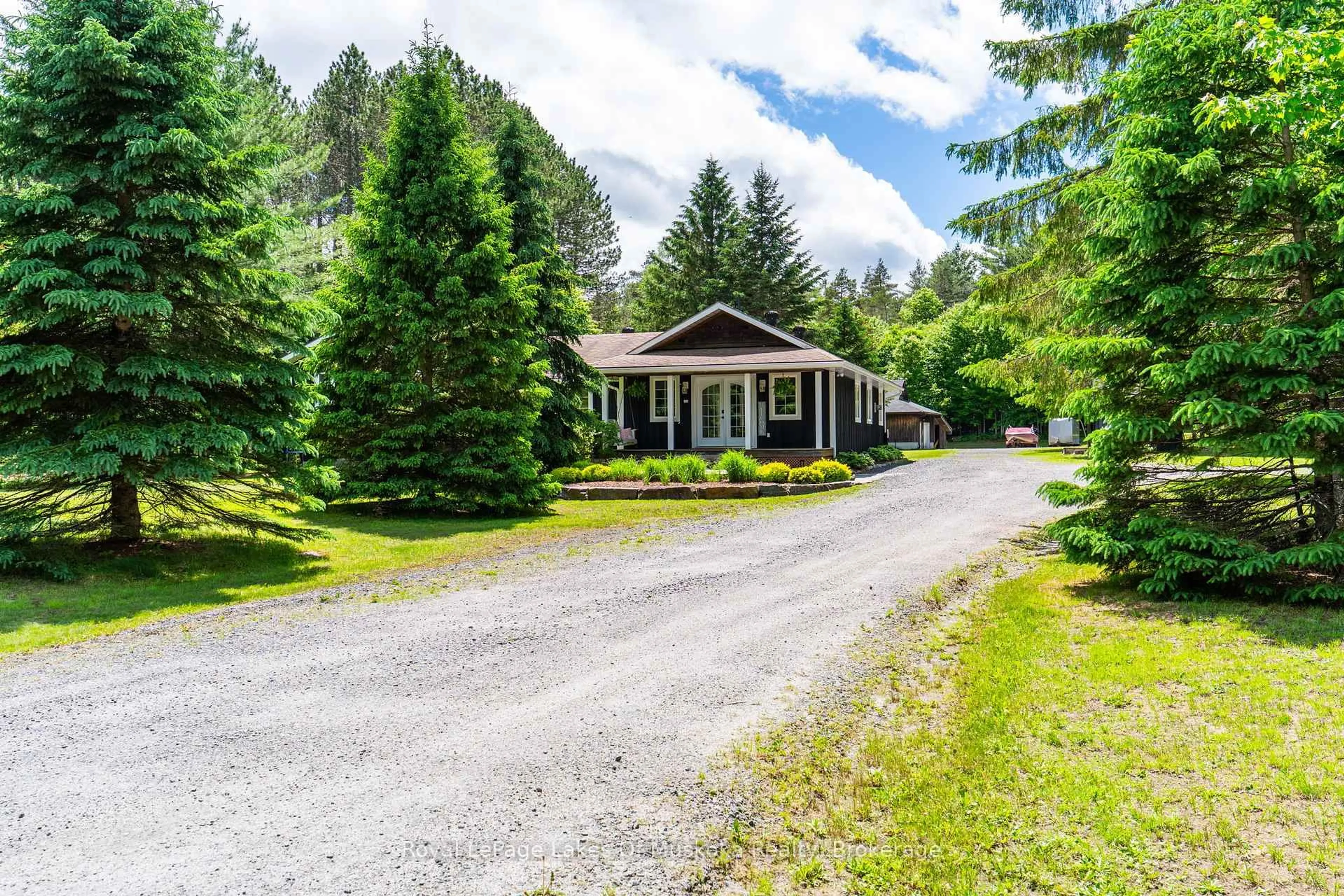 A pic from outside/outdoor area/front of a property/back of a property/a pic from drone, street for 764 Fowlers Rd, Huntsville Ontario P1H 2N5