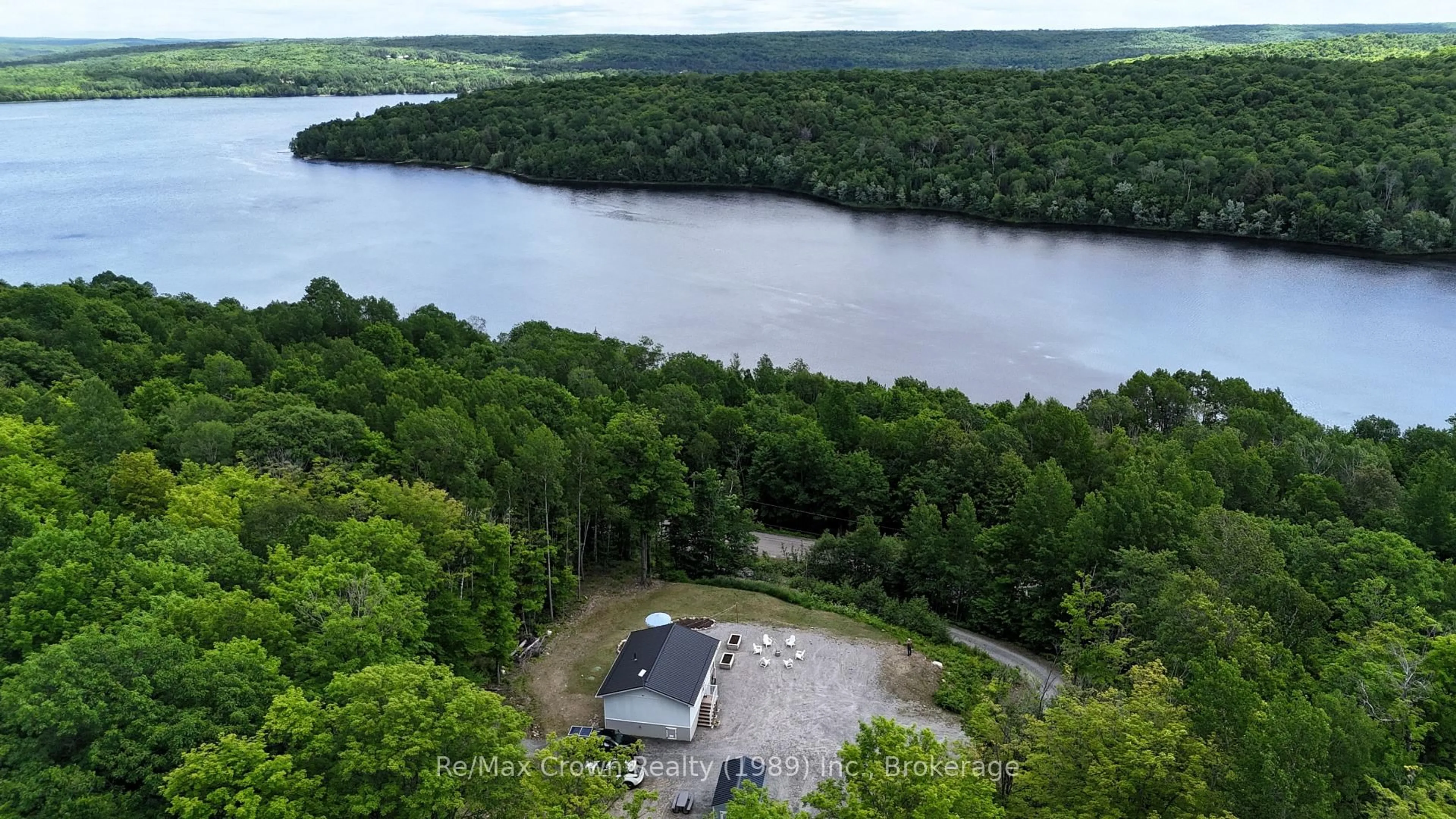 A pic from outside/outdoor area/front of a property/back of a property/a pic from drone, water/lake/river/ocean view for 1052 Limberlost Point Rd, Parry Sound Remote Area Ontario P0H 2R0