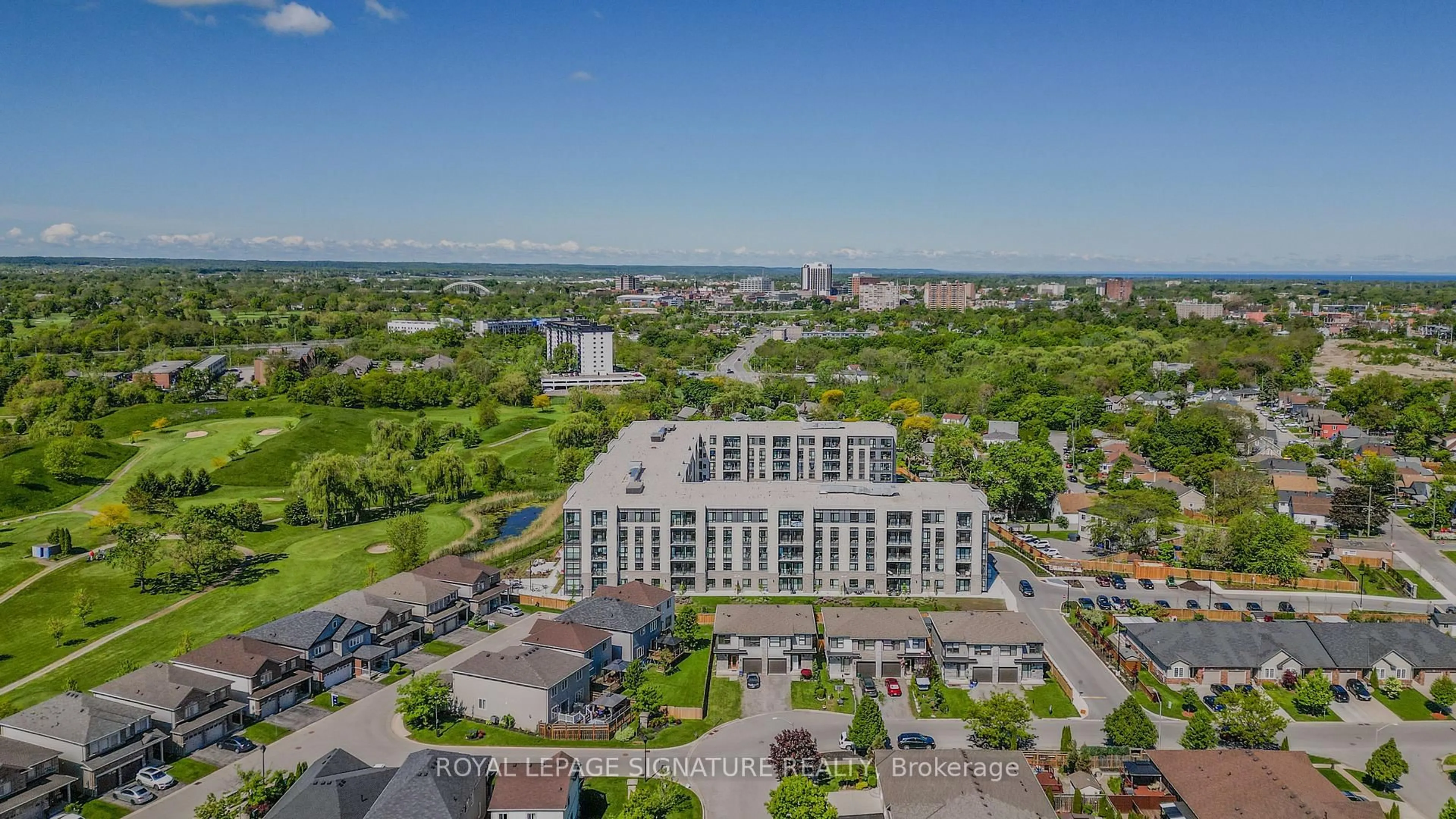 A pic from outside/outdoor area/front of a property/back of a property/a pic from drone, city buildings view from balcony for 50 Herrick Ave #UP27, St. Catharines Ontario L2P 0G3