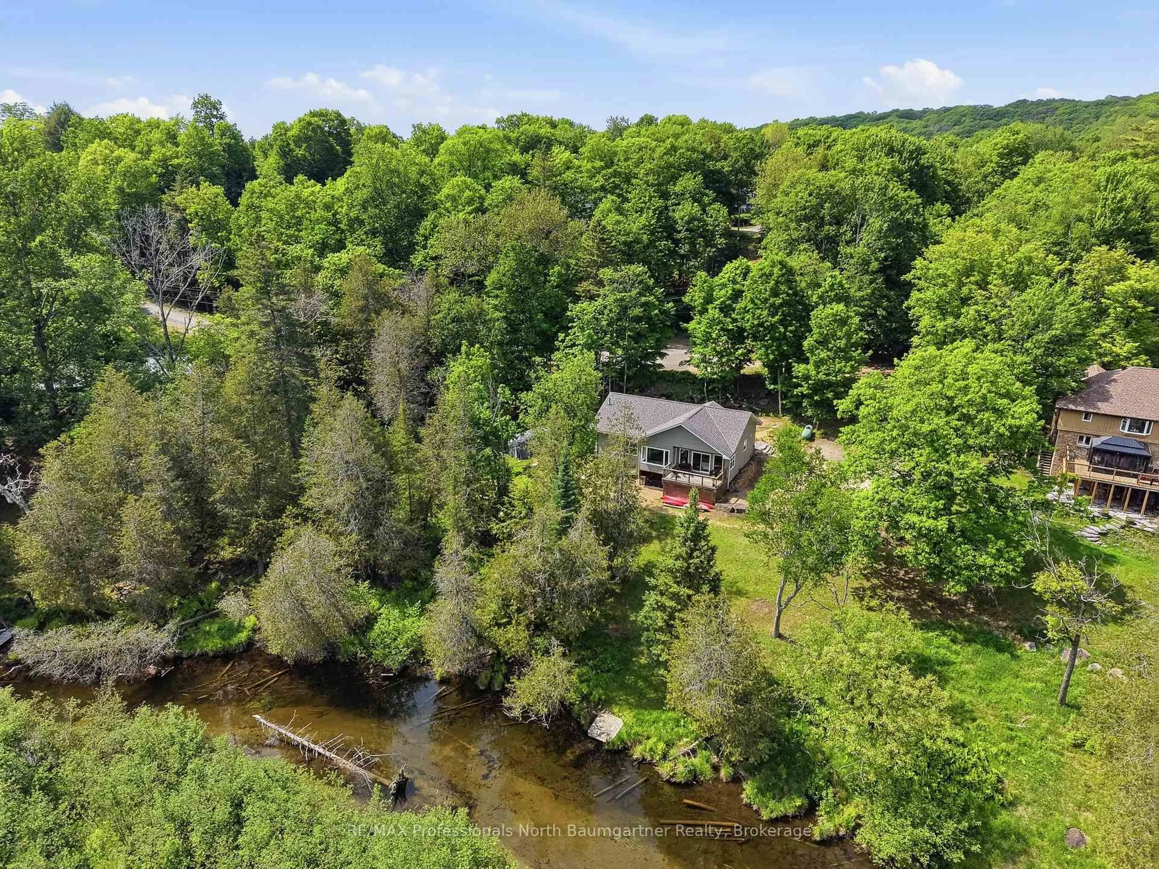 A pic from outside/outdoor area/front of a property/back of a property/a pic from drone, water/lake/river/ocean view for 50 Dean Crt, Dysart et al Ontario K0M 1S0