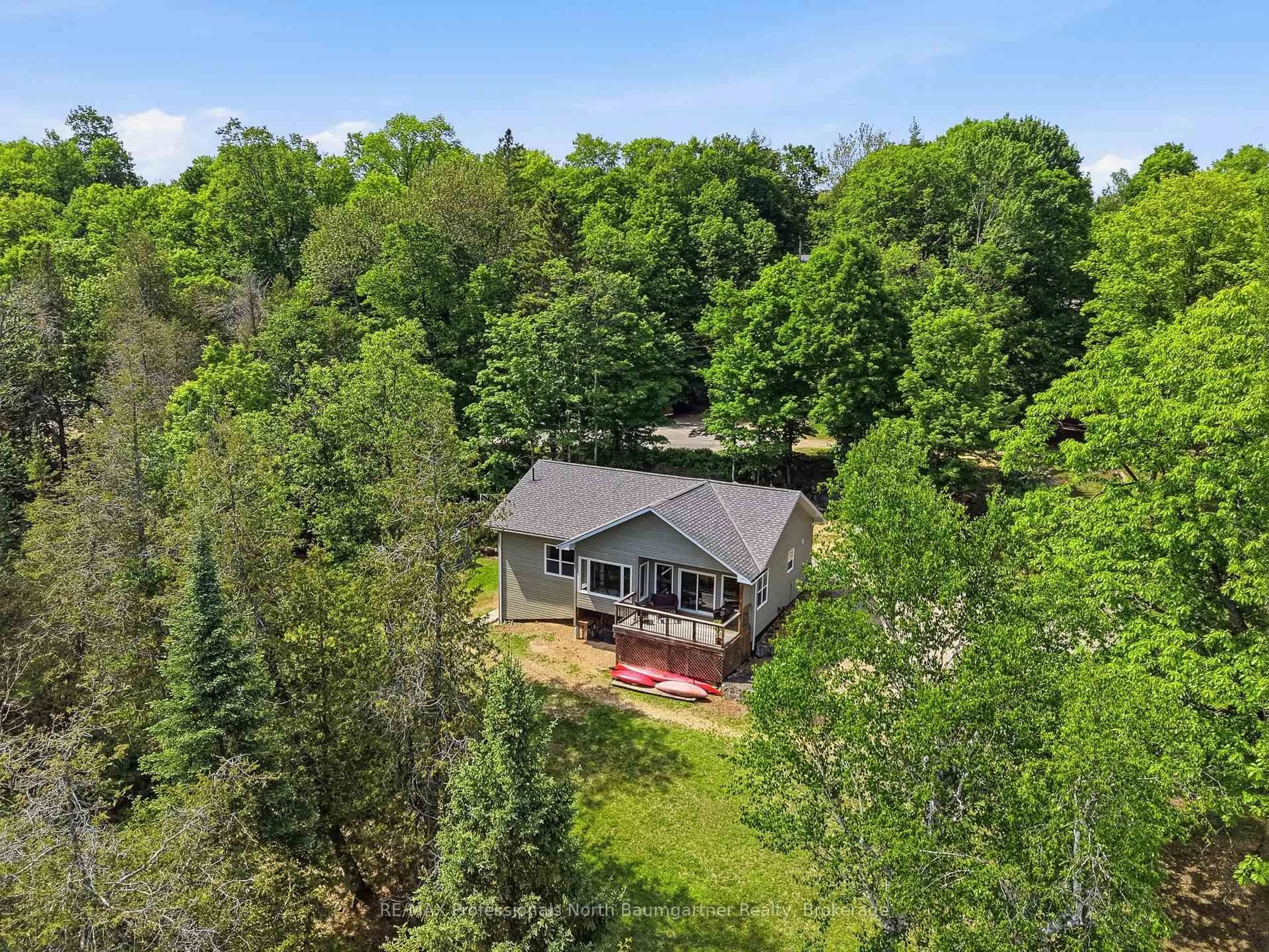 A pic from outside/outdoor area/front of a property/back of a property/a pic from drone, forest/trees view for 50 Dean Crt, Dysart et al Ontario K0M 1S0