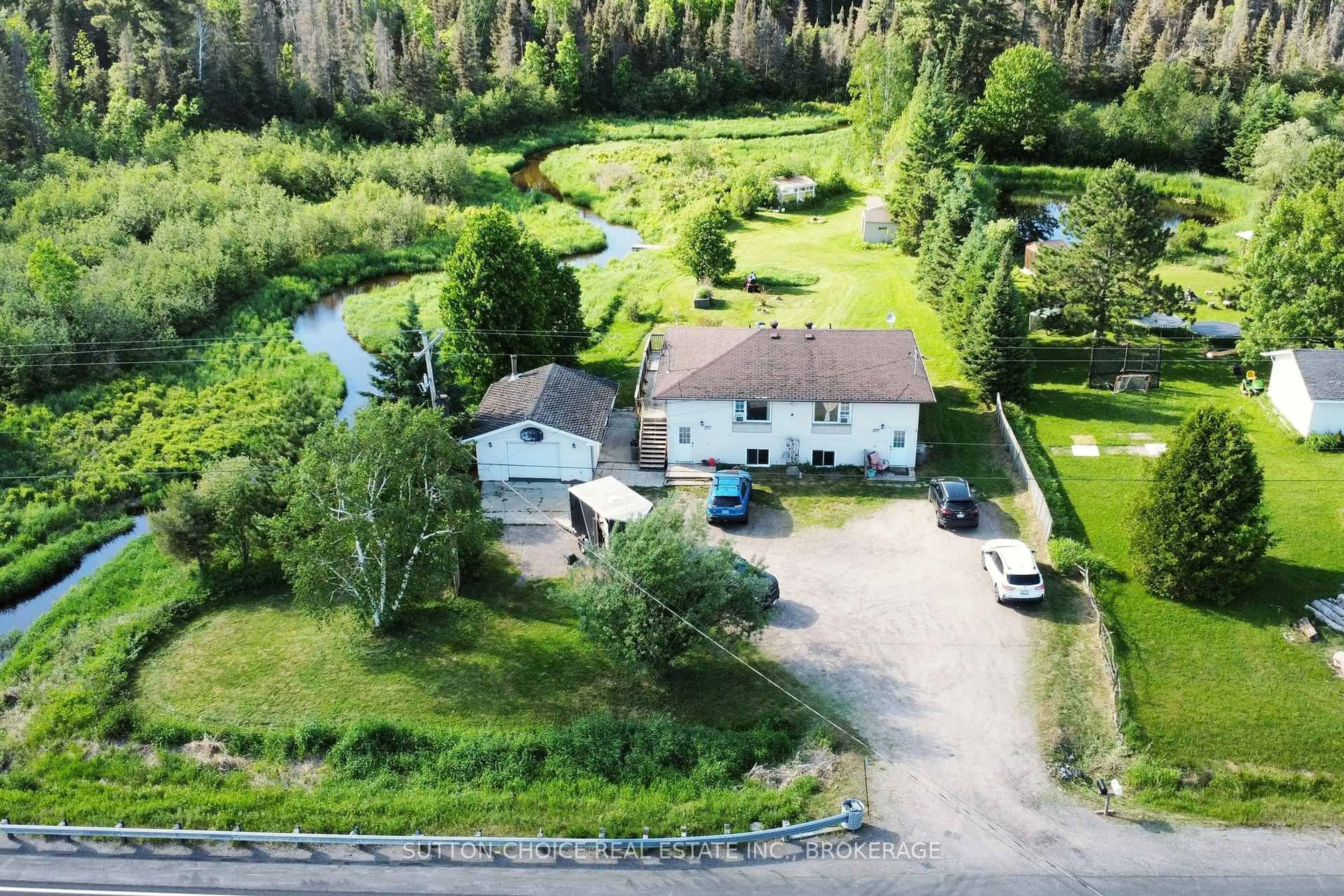 A pic from outside/outdoor area/front of a property/back of a property/a pic from drone, unknown for 606 Highway 94, East Ferris Ontario P0H 1K0