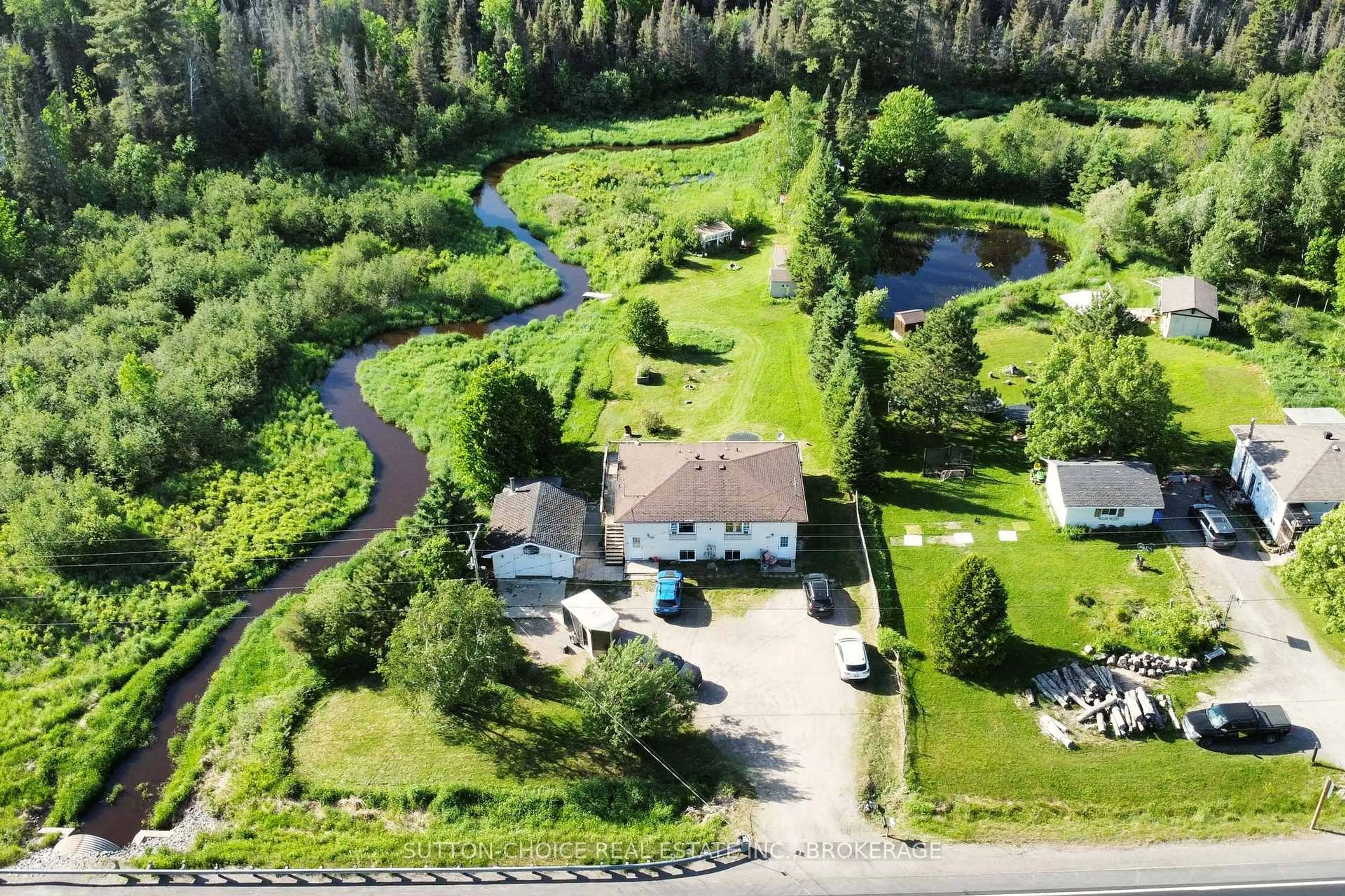 A pic from outside/outdoor area/front of a property/back of a property/a pic from drone, water/lake/river/ocean view for 606 Highway 94, East Ferris Ontario P0H 1K0