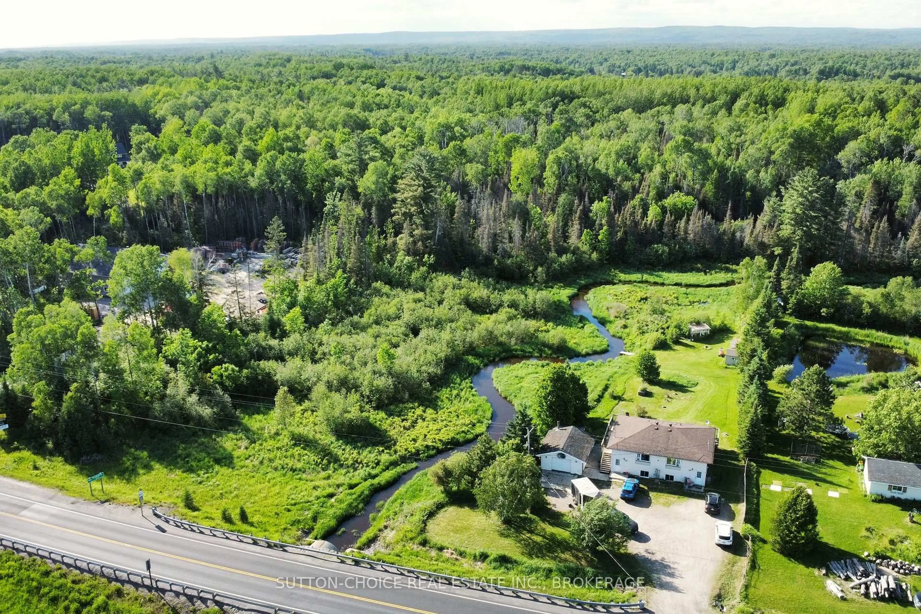 A pic from outside/outdoor area/front of a property/back of a property/a pic from drone, forest/trees view for 606 Highway 94, East Ferris Ontario P0H 1K0