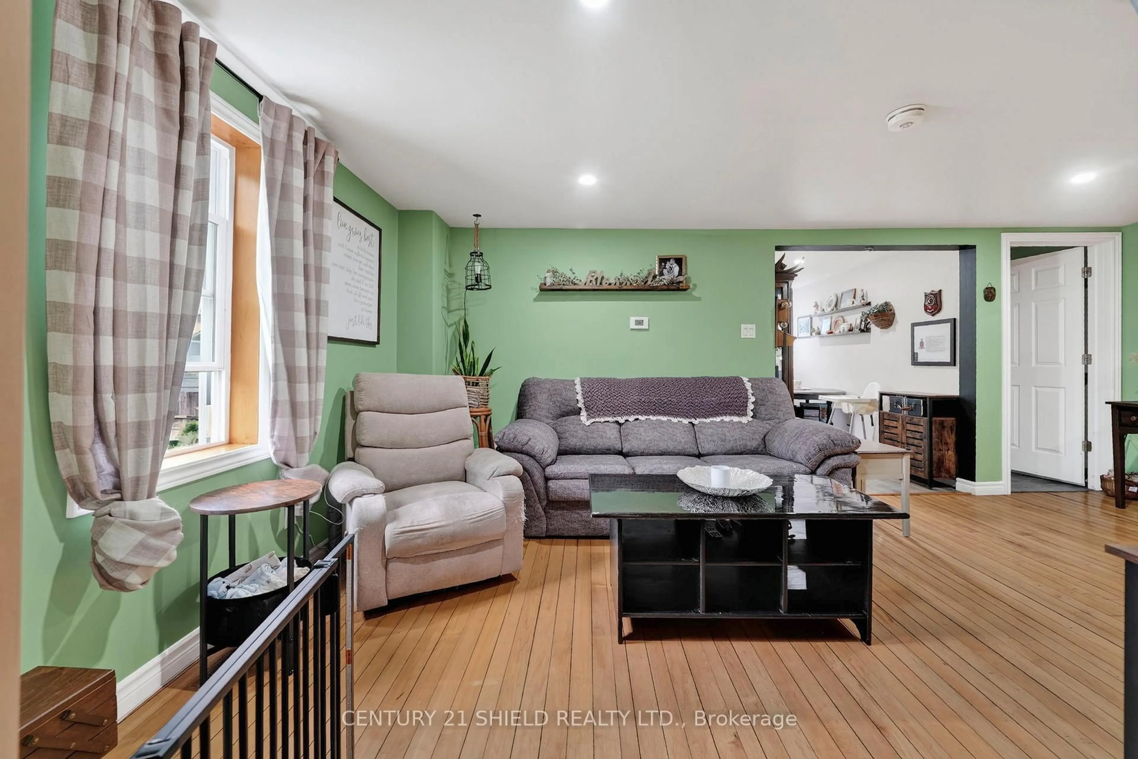 Living room with furniture, wood/laminate floor for 21149 Concession 5 Rd, South Glengarry Ontario K0C 1Z0