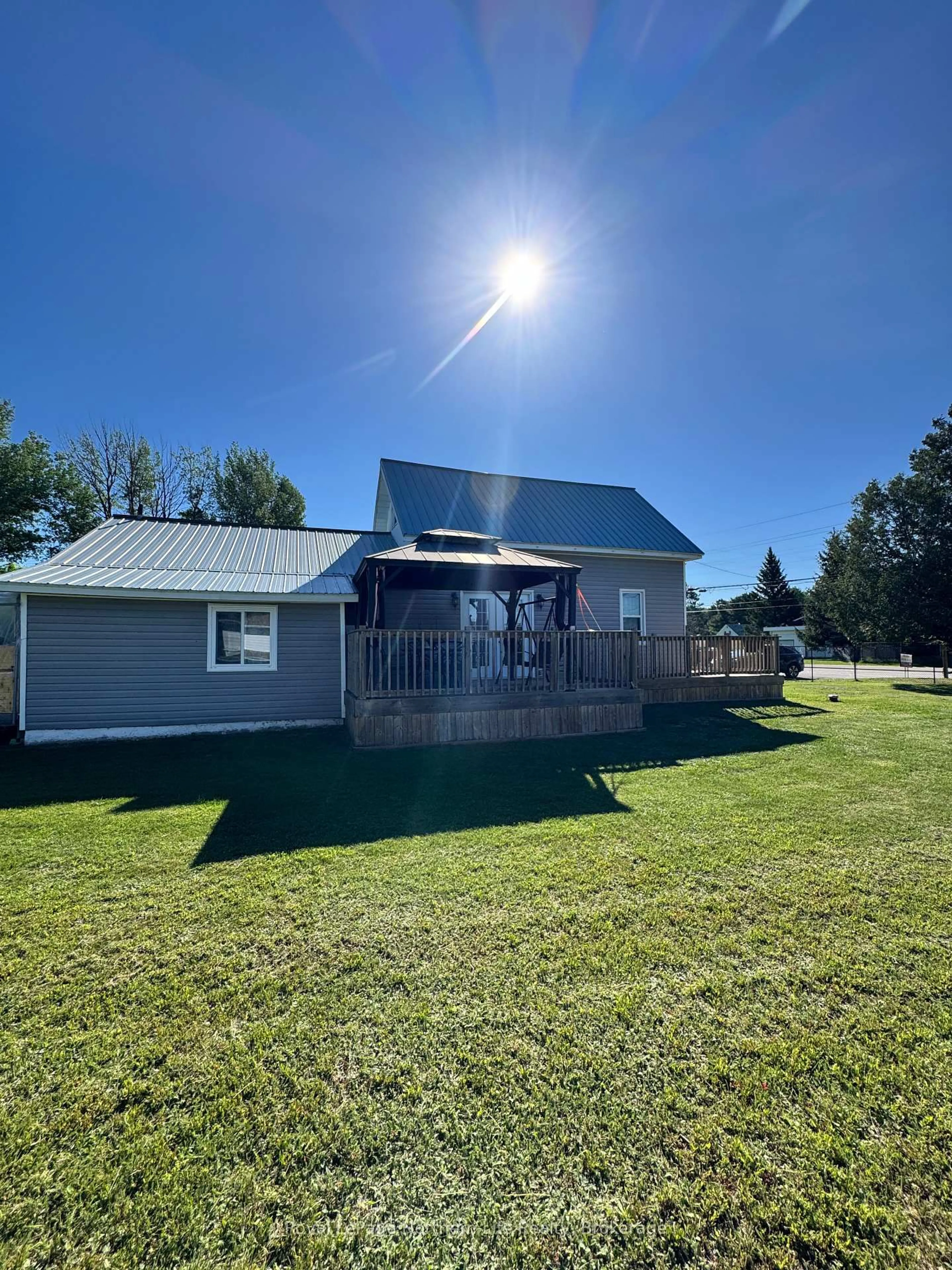 A pic from outside/outdoor area/front of a property/back of a property/a pic from drone, water/lake/river/ocean view for 176 Main St, Powassan Ontario P0H 2L0