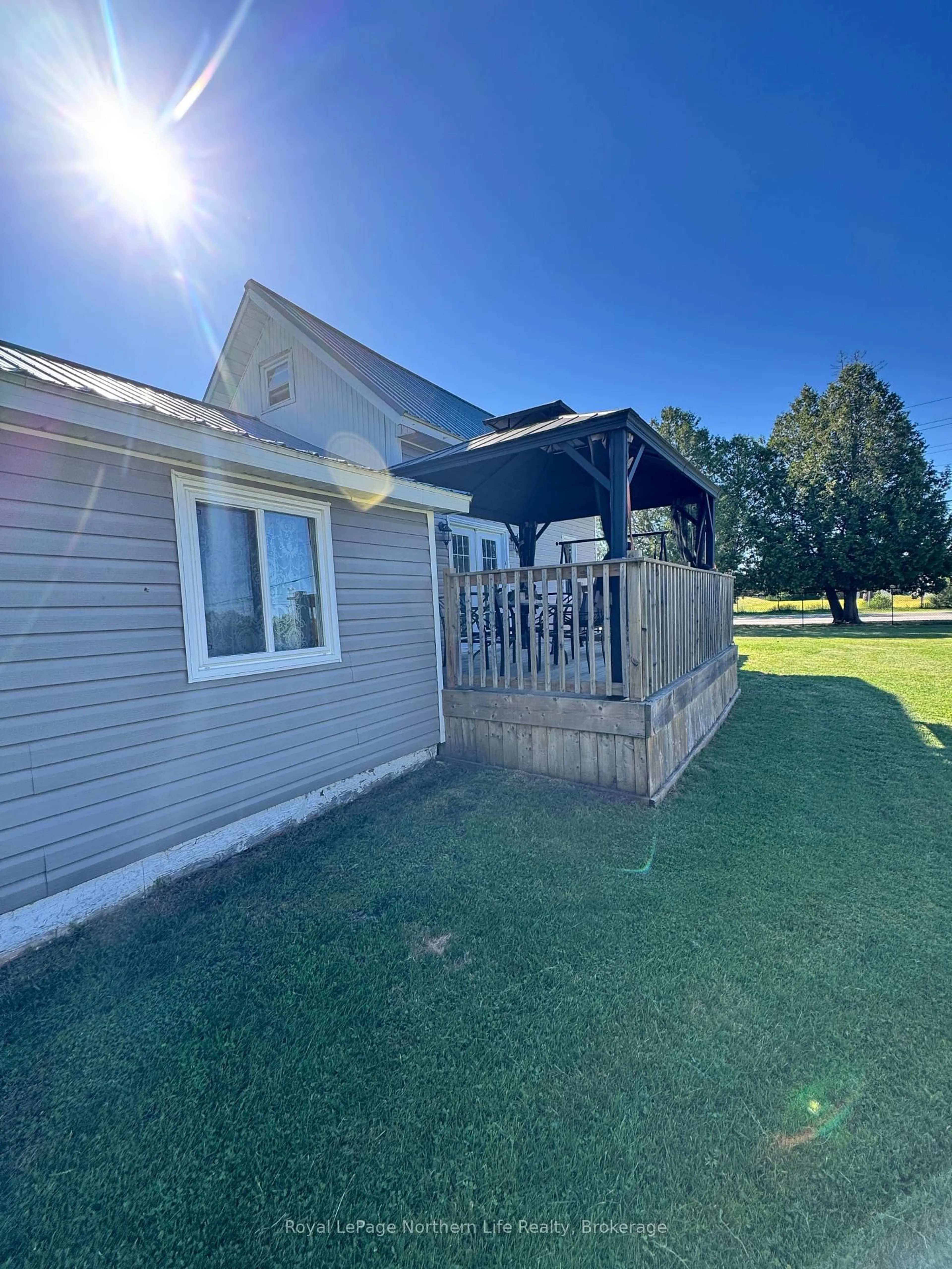 A pic from outside/outdoor area/front of a property/back of a property/a pic from drone, water/lake/river/ocean view for 176 Main St, Powassan Ontario P0H 2L0