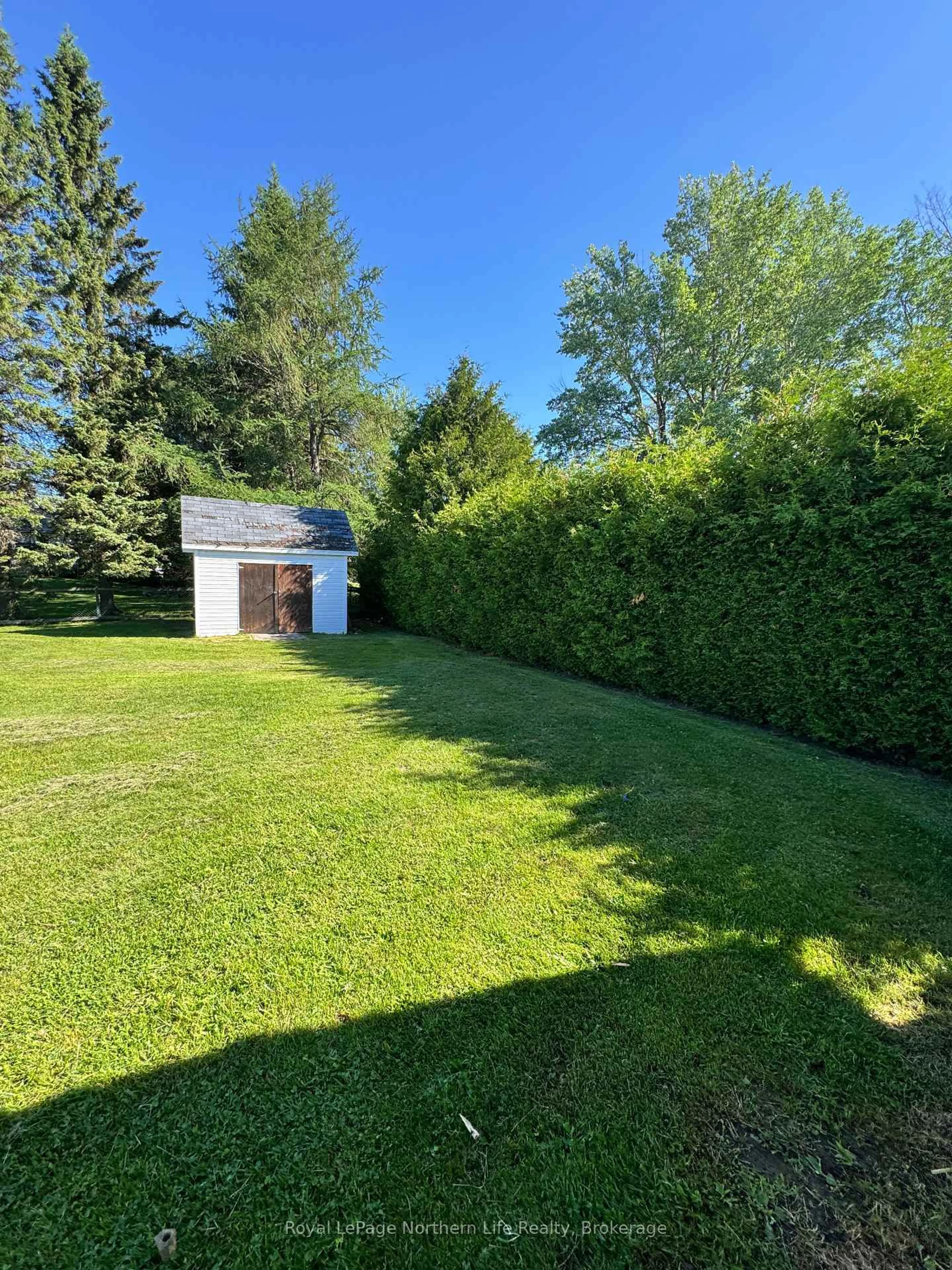 A pic from outside/outdoor area/front of a property/back of a property/a pic from drone, forest/trees view for 176 Main St, Powassan Ontario P0H 2L0