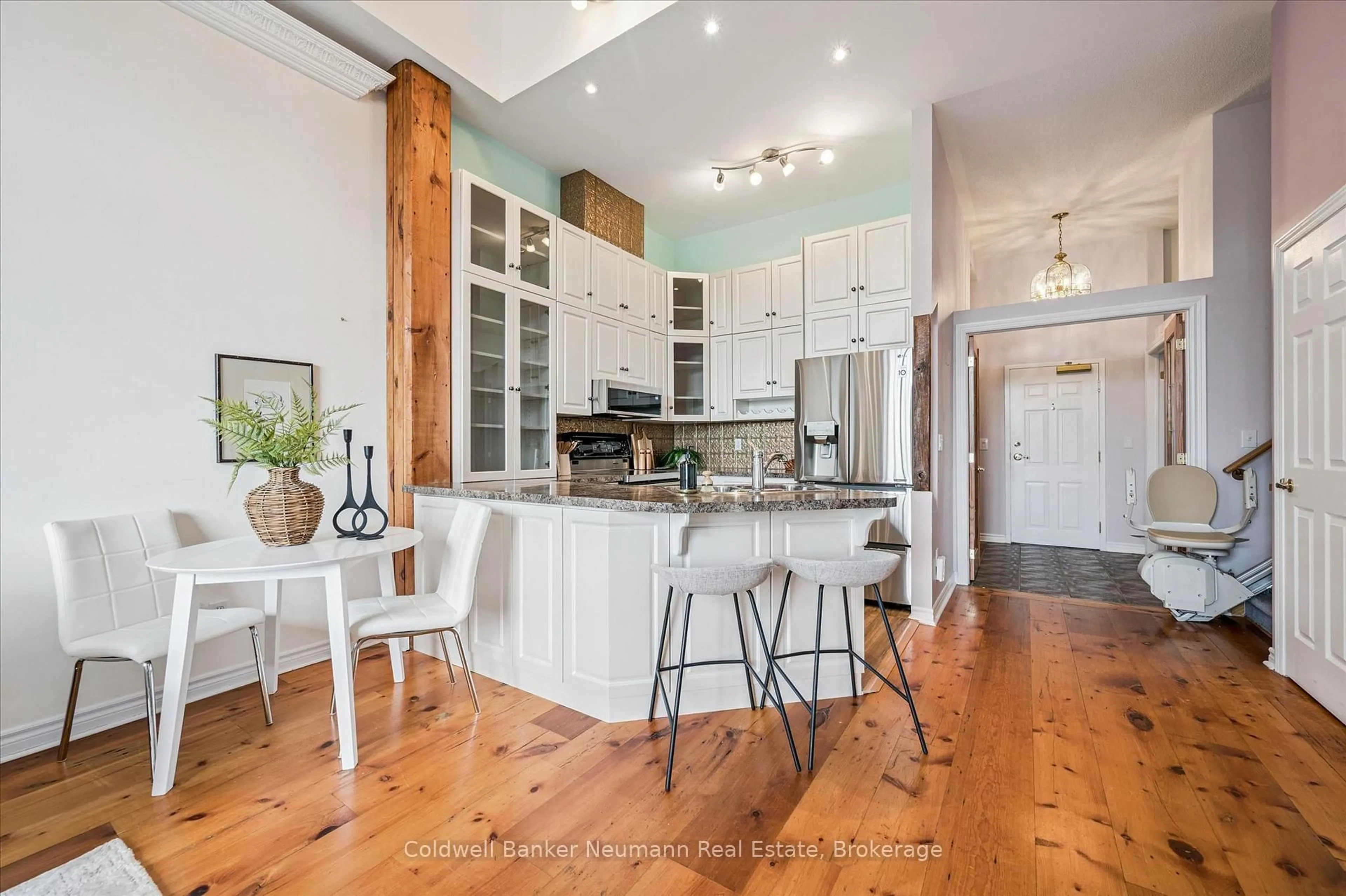 Open concept kitchen, wood/laminate floor for 478 St Andrew St #306, Centre Wellington Ontario N1M 3V7