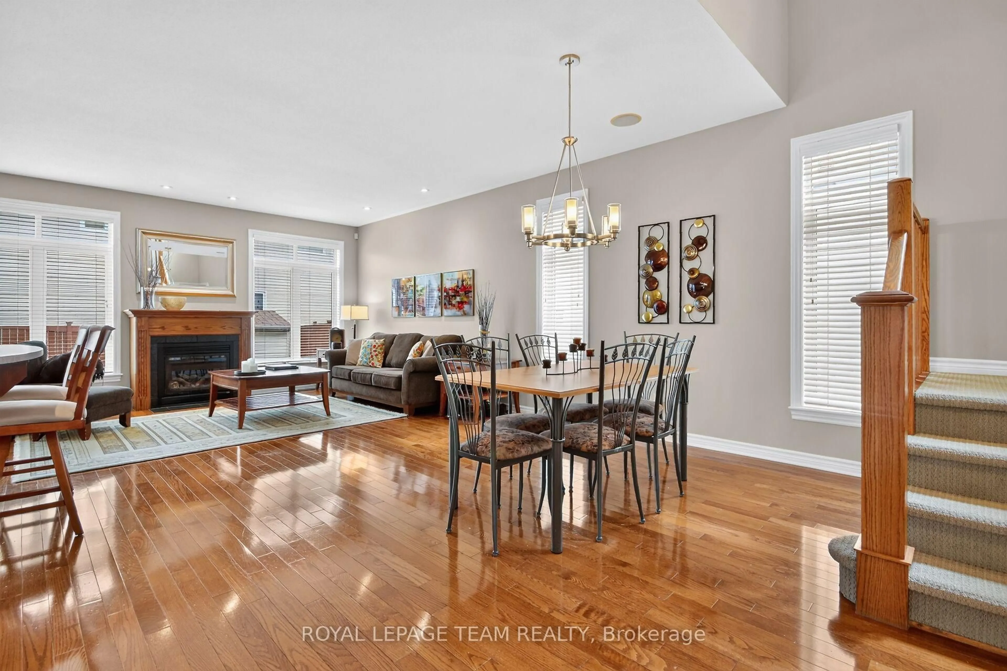 Living room with furniture, wood/laminate floor for 83 Lydia Way, Ottawa Ontario K2G 7E4