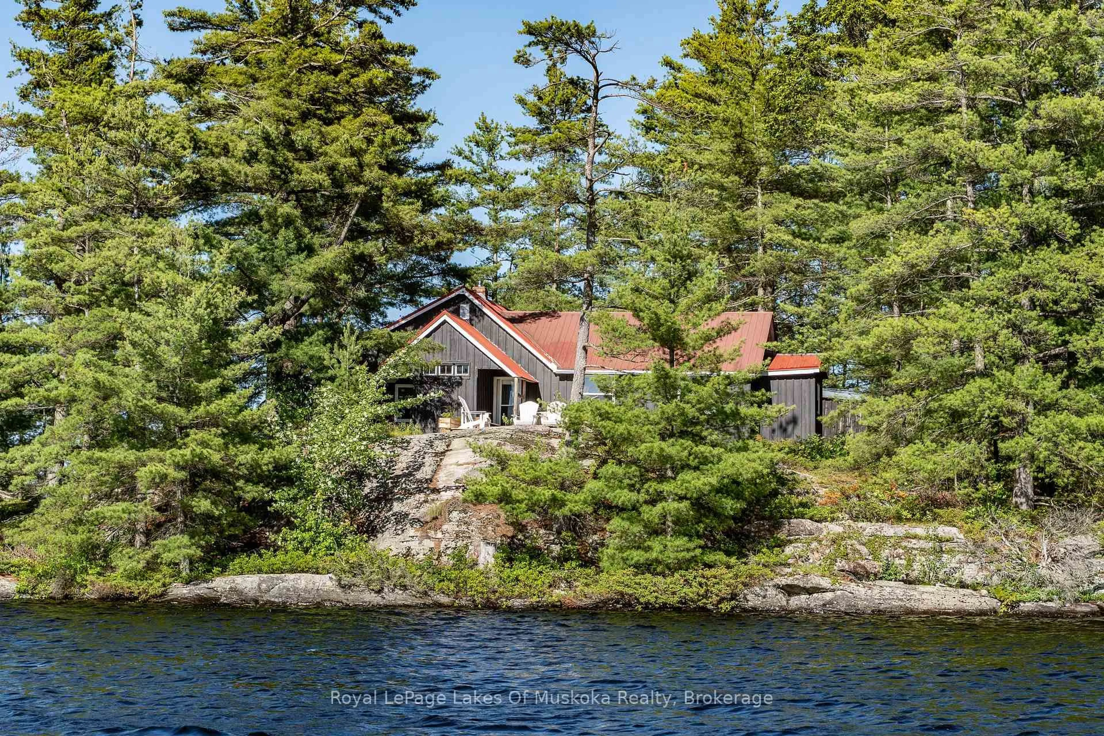 A pic from outside/outdoor area/front of a property/back of a property/a pic from drone, water/lake/river/ocean view for 1 Island 9KL (1 Chief Island), Gravenhurst Ontario P0E 1G0