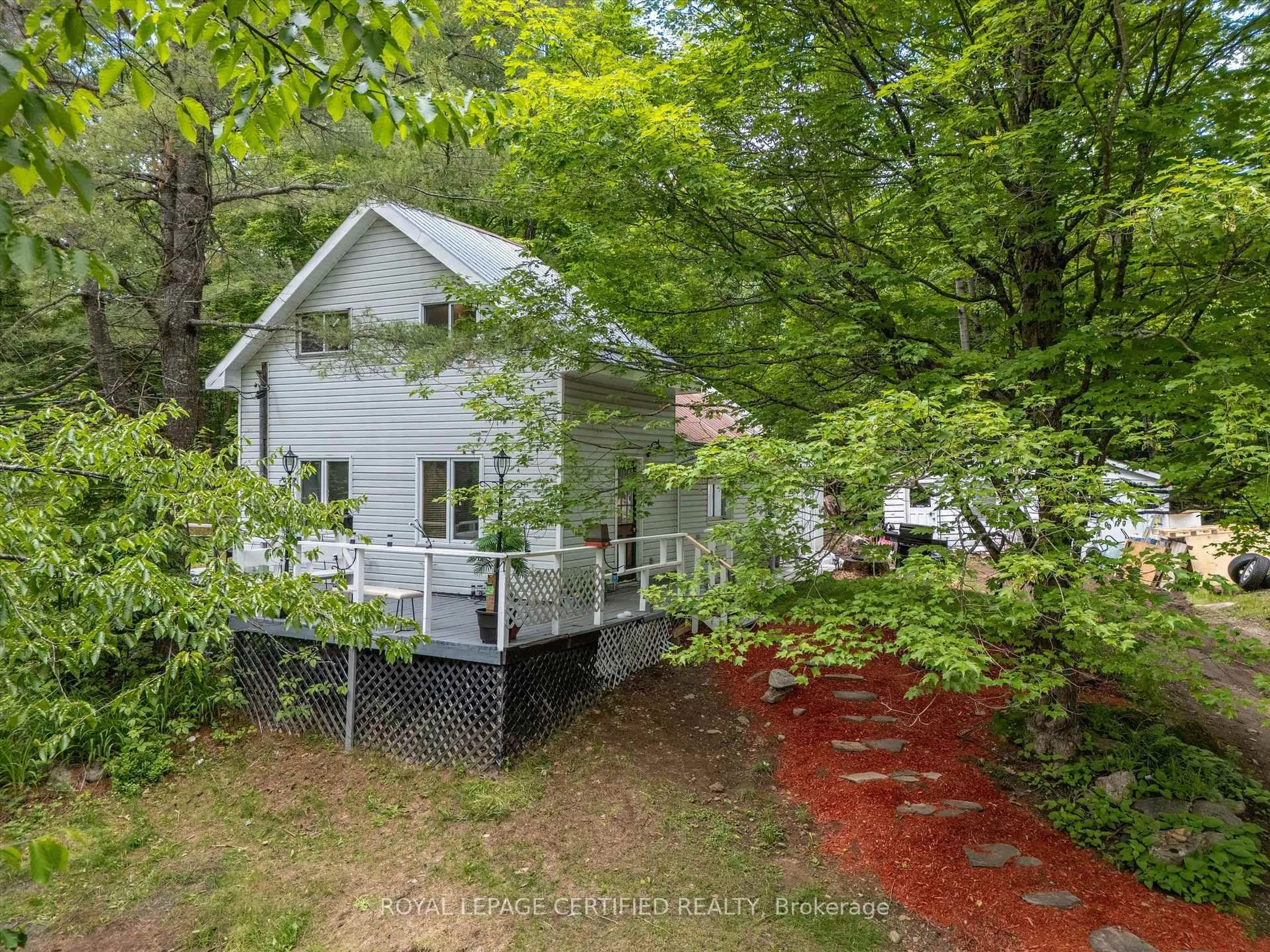 A pic from outside/outdoor area/front of a property/back of a property/a pic from drone, forest/trees view for 240 Britannia Rd, Huntsville Ontario P1H 2J3