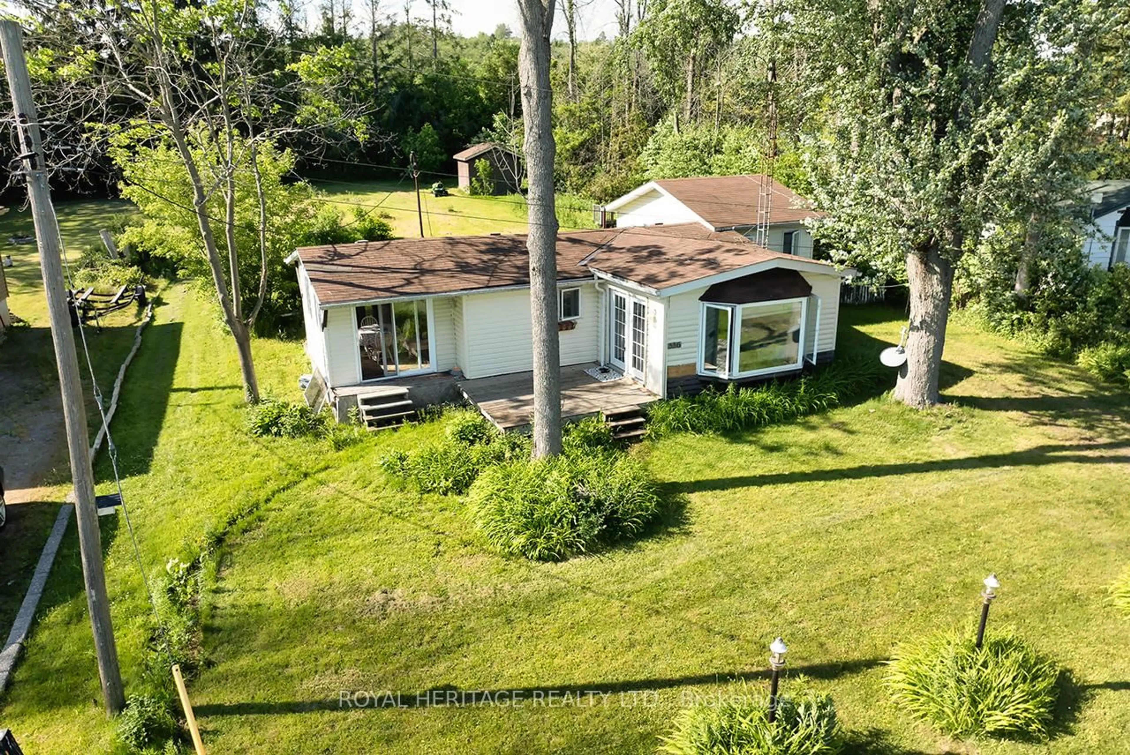 A pic from outside/outdoor area/front of a property/back of a property/a pic from drone, water/lake/river/ocean view for 556 North Shore Dr, Otonabee-South Monaghan Ontario K0L 1B0
