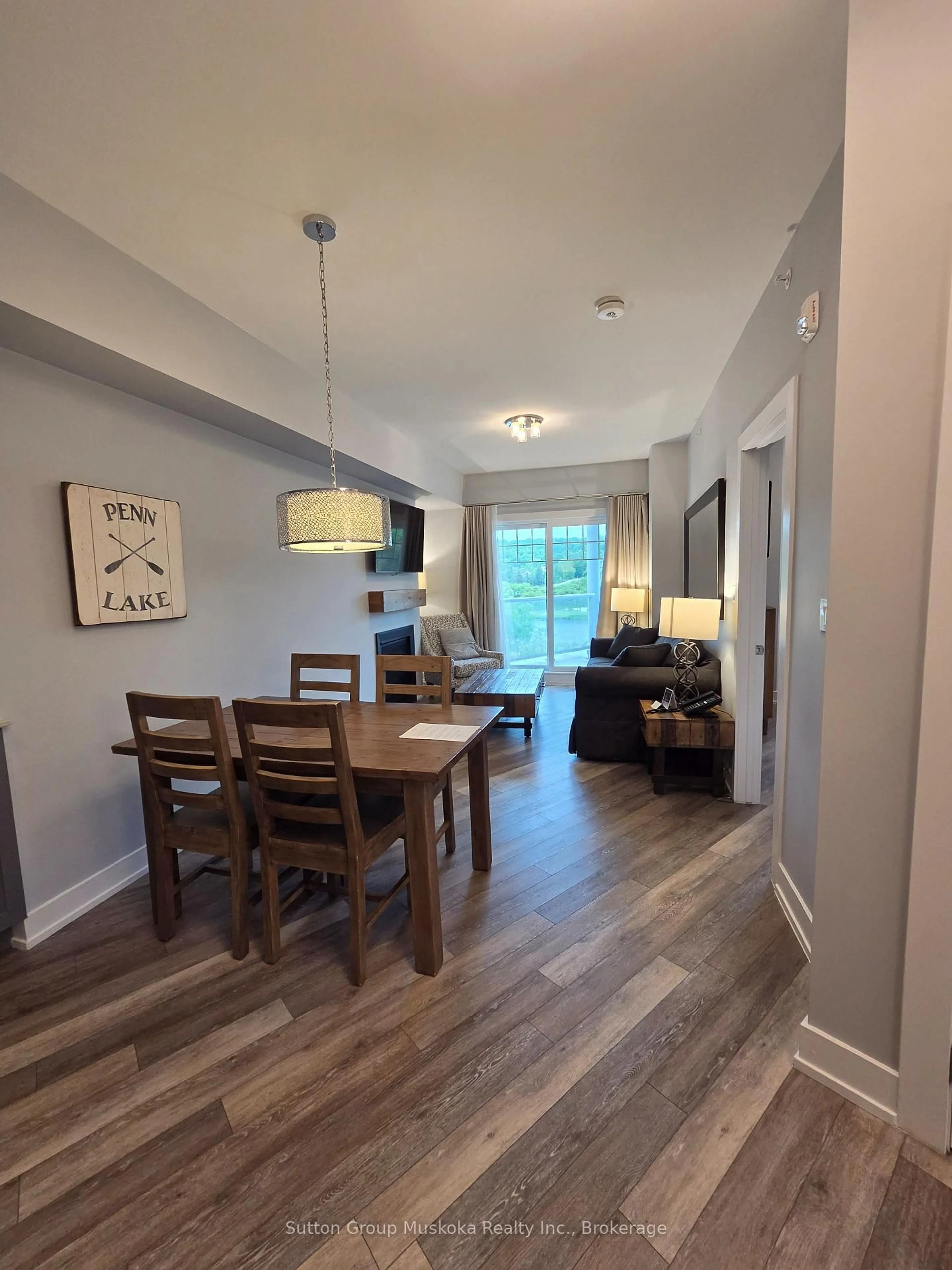 Dining room, wood/laminate floor for 25 Pen Lake Point Rd #208, Huntsville Ontario P1H 1A9