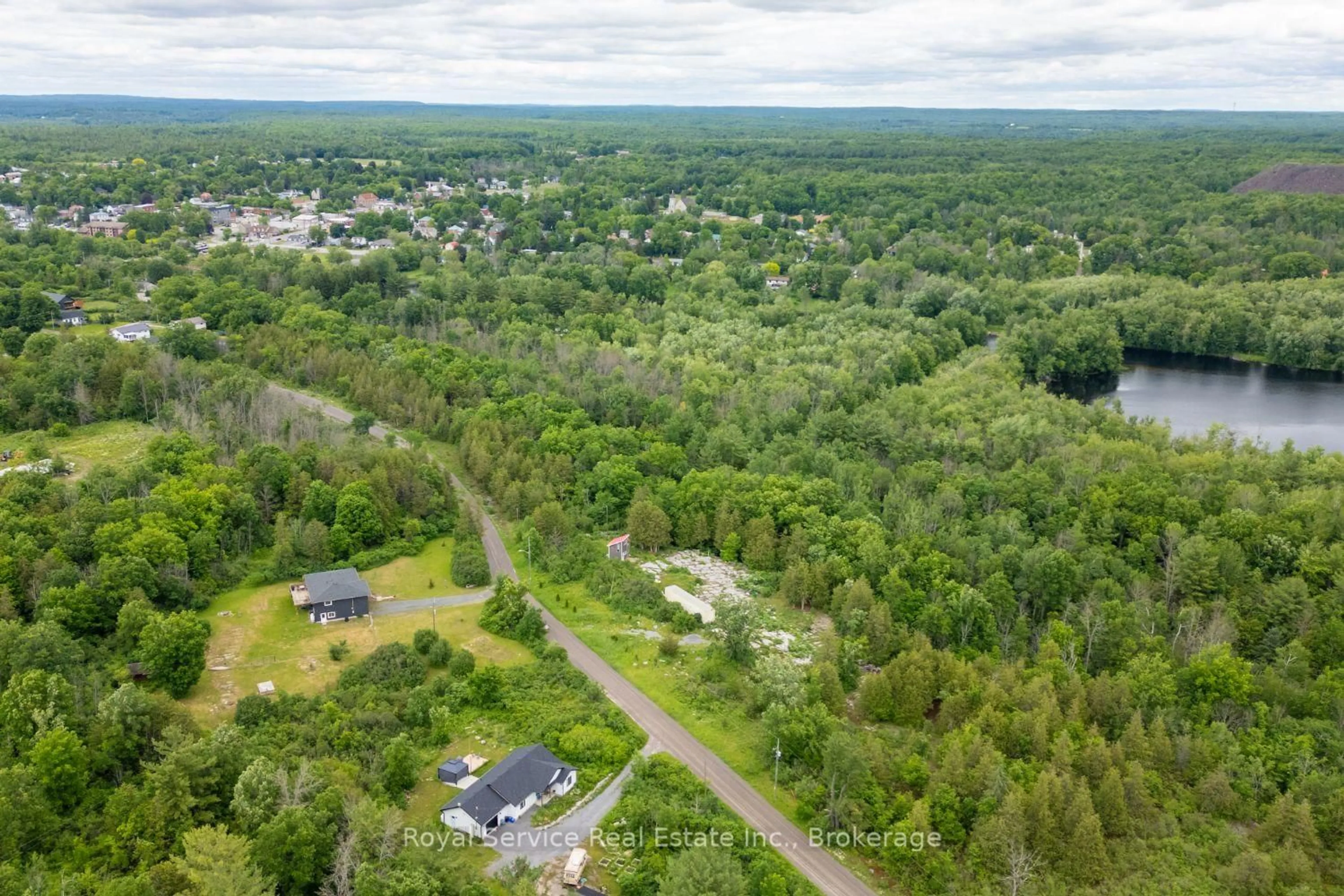 A pic from outside/outdoor area/front of a property/back of a property/a pic from drone, forest/trees view for 72 James St, Limoges Ontario K0K 2M0