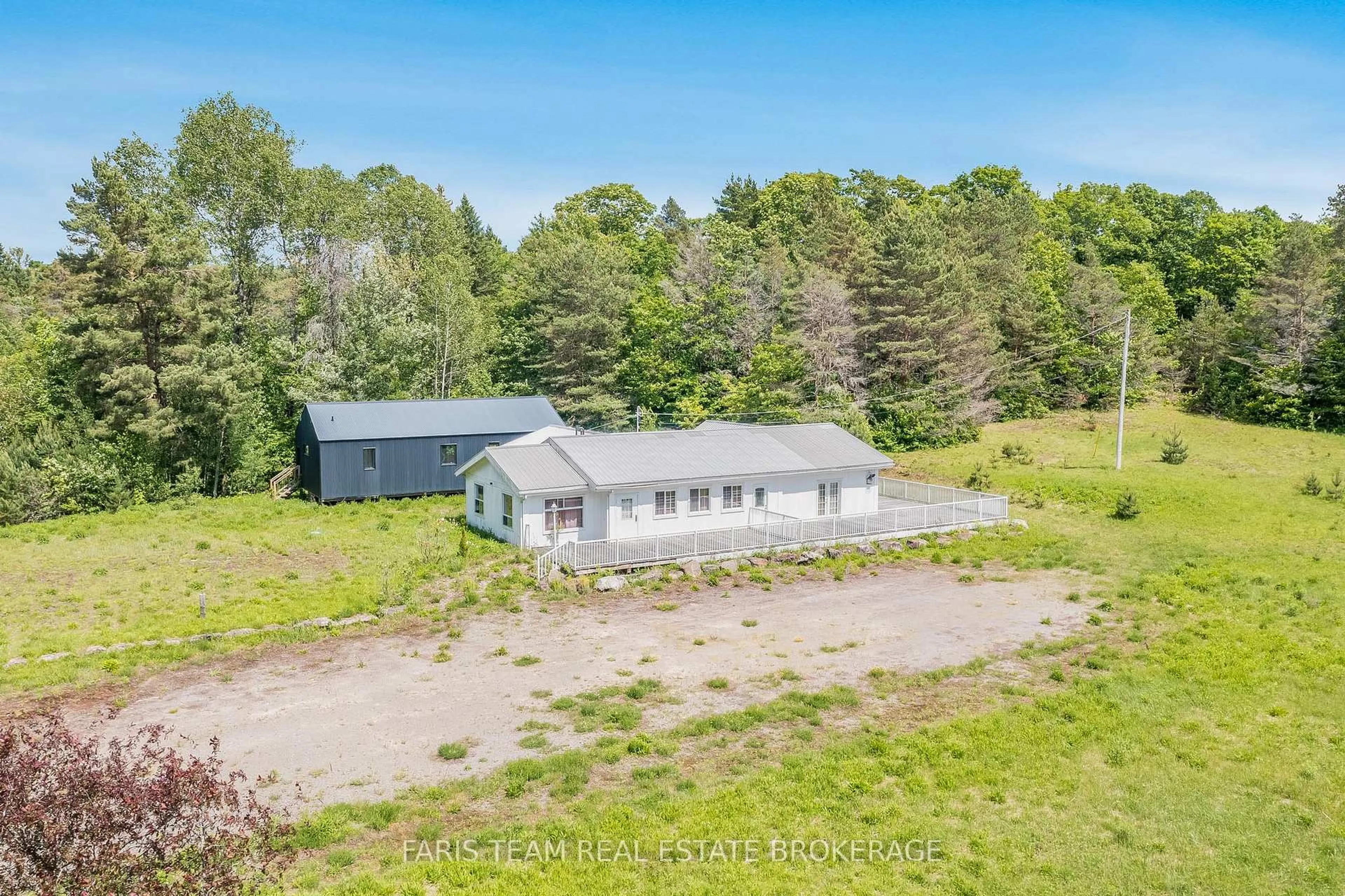 A pic from outside/outdoor area/front of a property/back of a property/a pic from drone, unknown for 2180-2186 Highway 141, Muskoka Lakes Ontario P0B 1L0