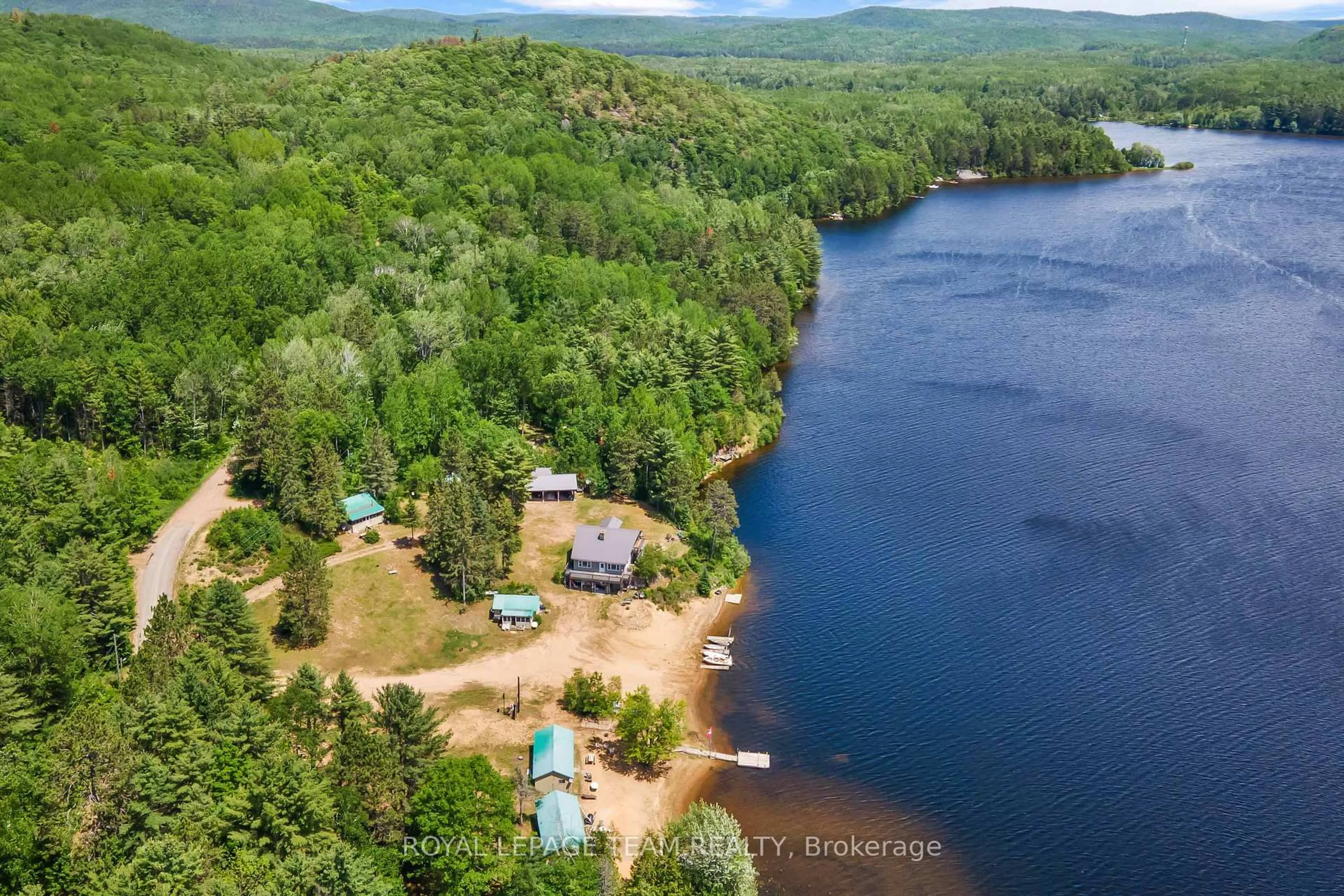 A pic from outside/outdoor area/front of a property/back of a property/a pic from drone, water/lake/river/ocean view for 682 Long Lake Rd, Barry's Bay Ontario K0J 1B0