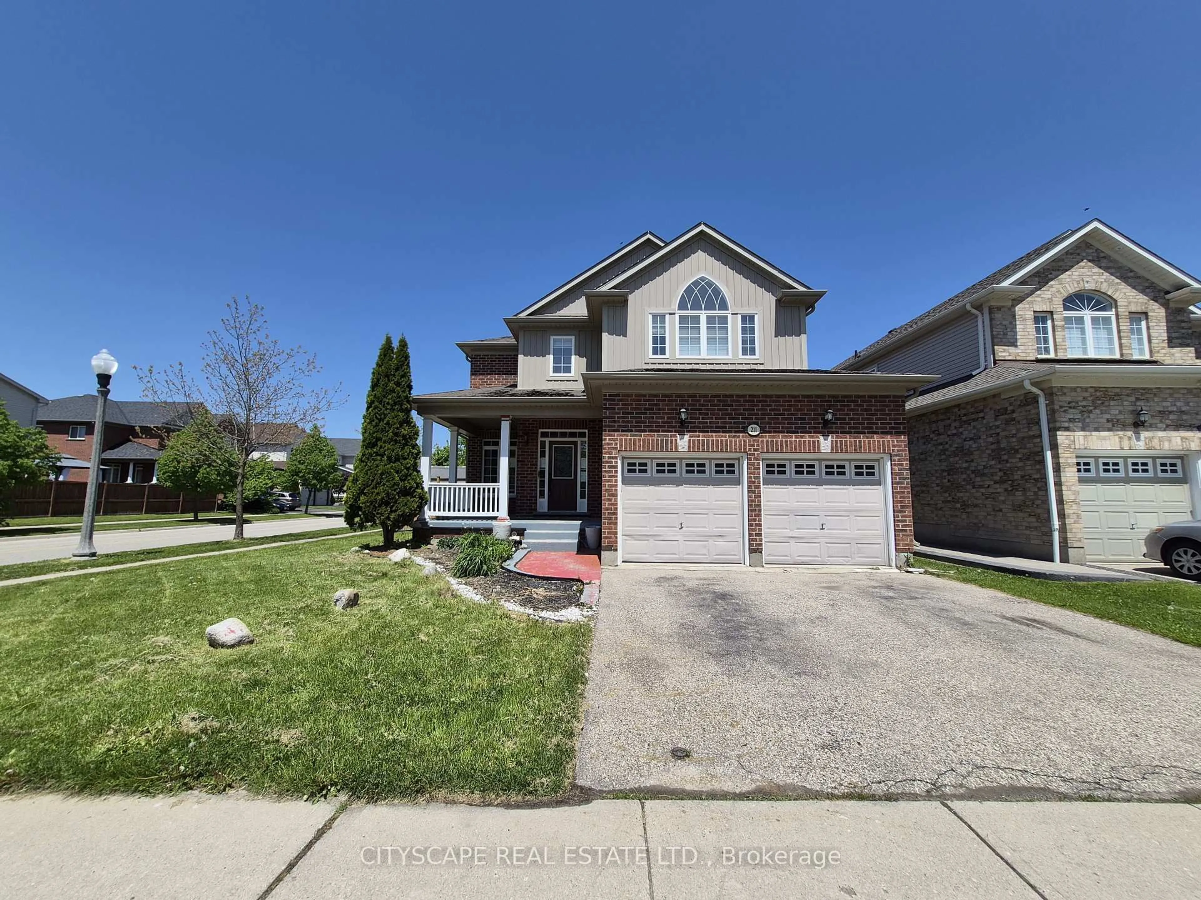 Home with brick exterior material, street for 211 Sims Estate Dr, Kitchener Ontario N2A 4L2