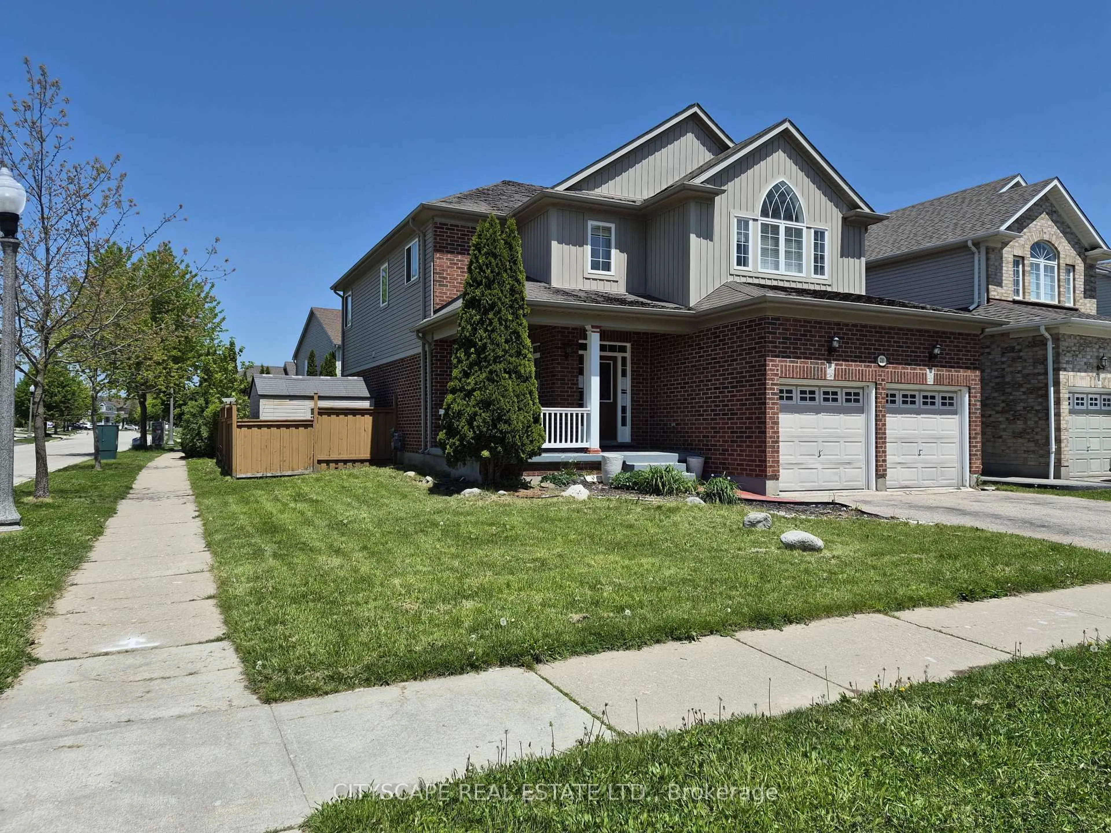 Home with brick exterior material, street for 211 Sims Estate Dr, Kitchener Ontario N2A 4L2