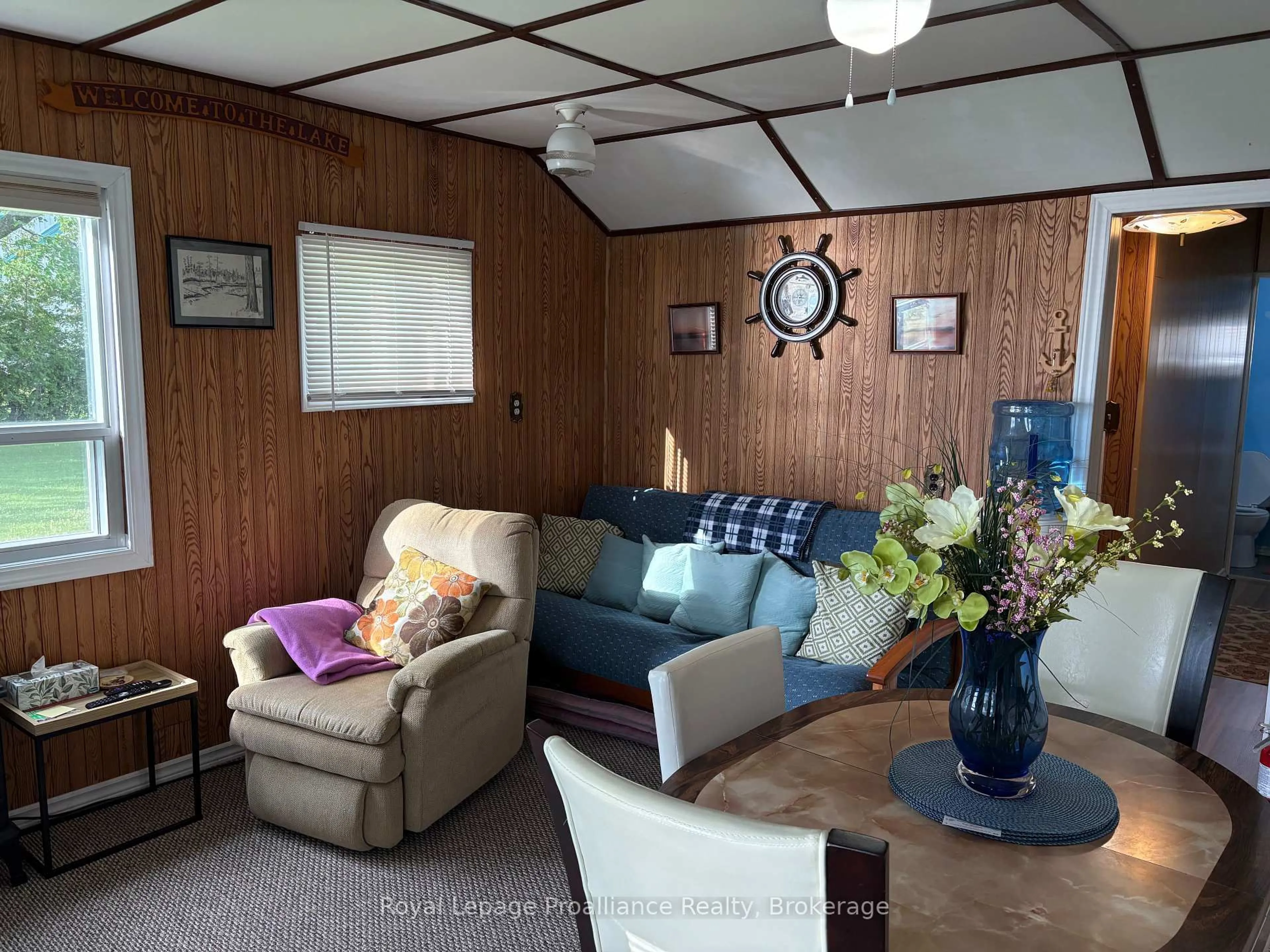Living room with furniture, wood/laminate floor for 22 Lake Rd #15, Trent Hills Ontario K0L 1L0