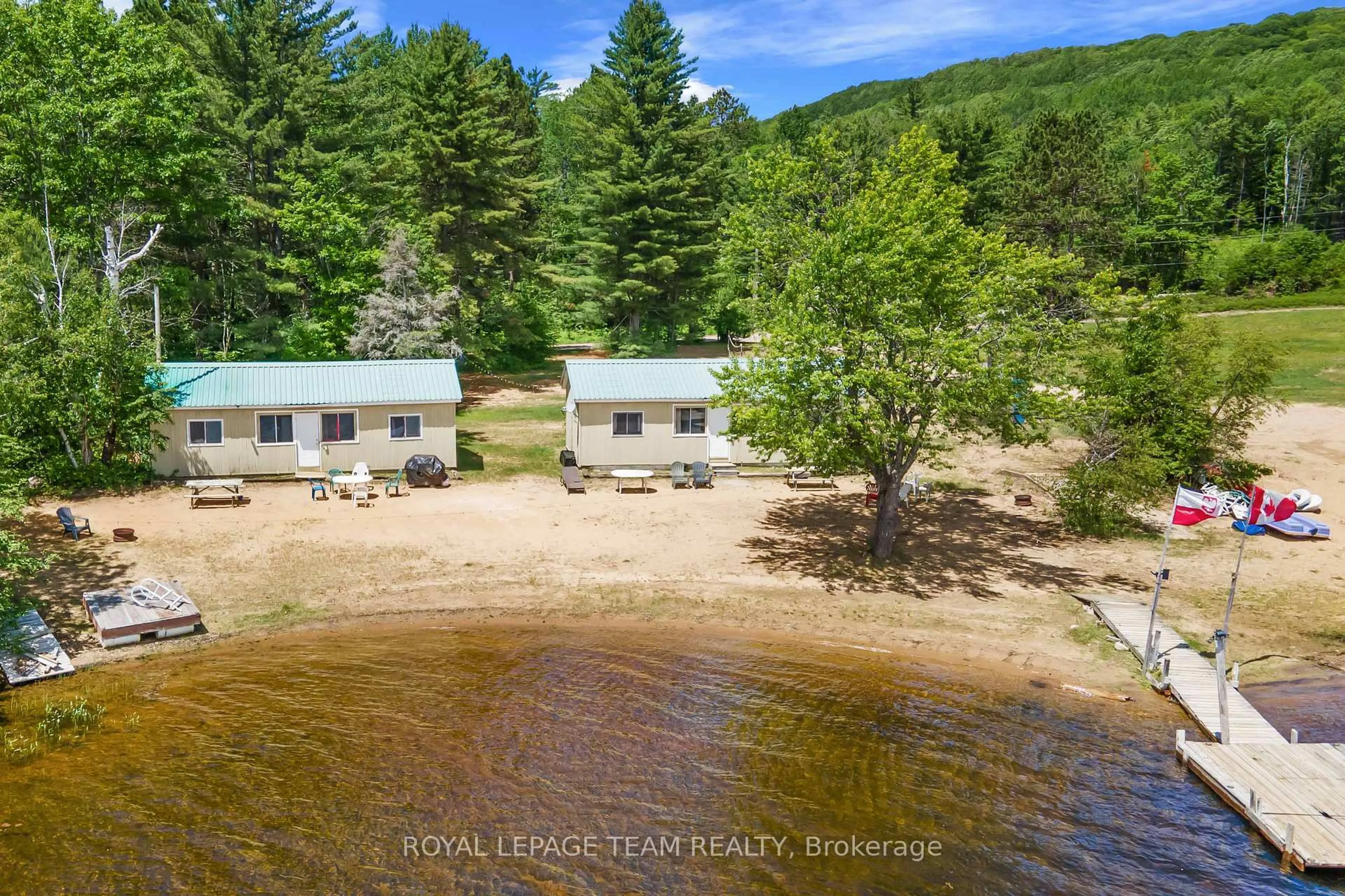 A pic from outside/outdoor area/front of a property/back of a property/a pic from drone, water/lake/river/ocean view for 662 Long Lake Rd, Barry's Bay Ontario K0J 1B0