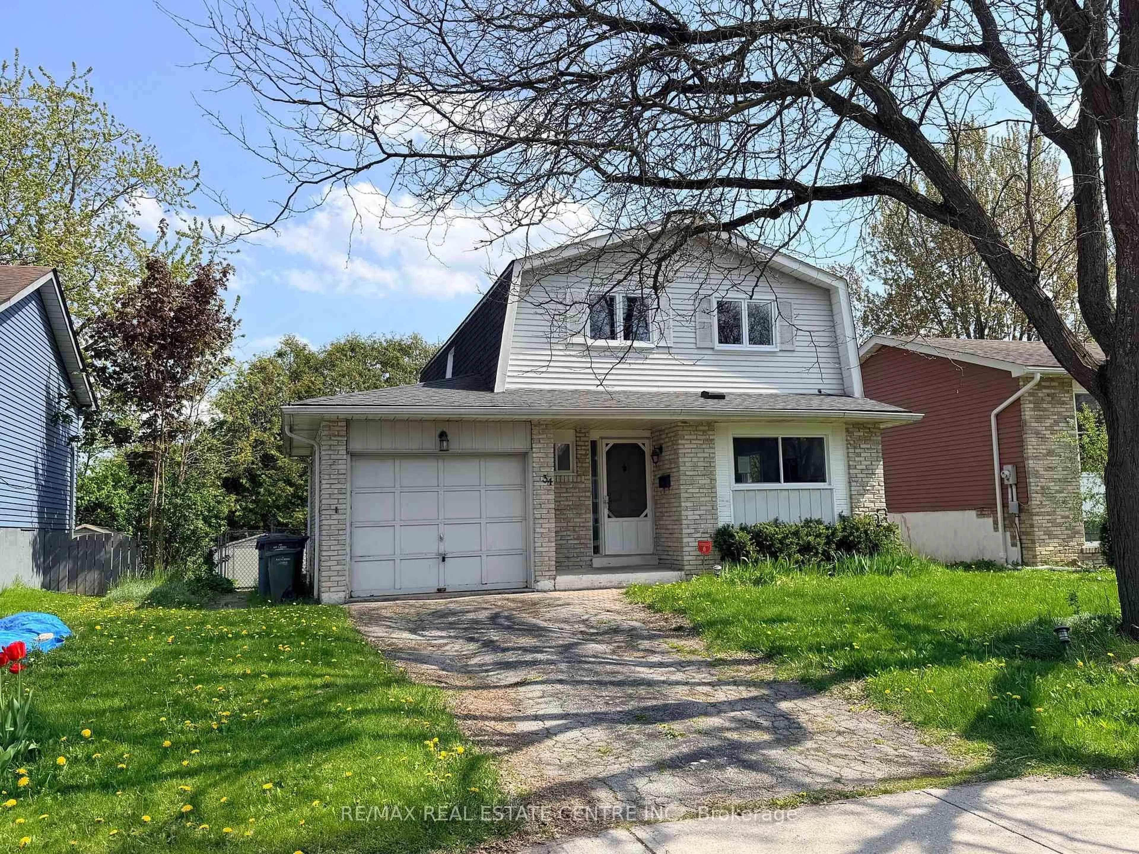 Home with vinyl exterior material, street for 34 Woodridge Dr, Guelph Ontario N1H 7E2