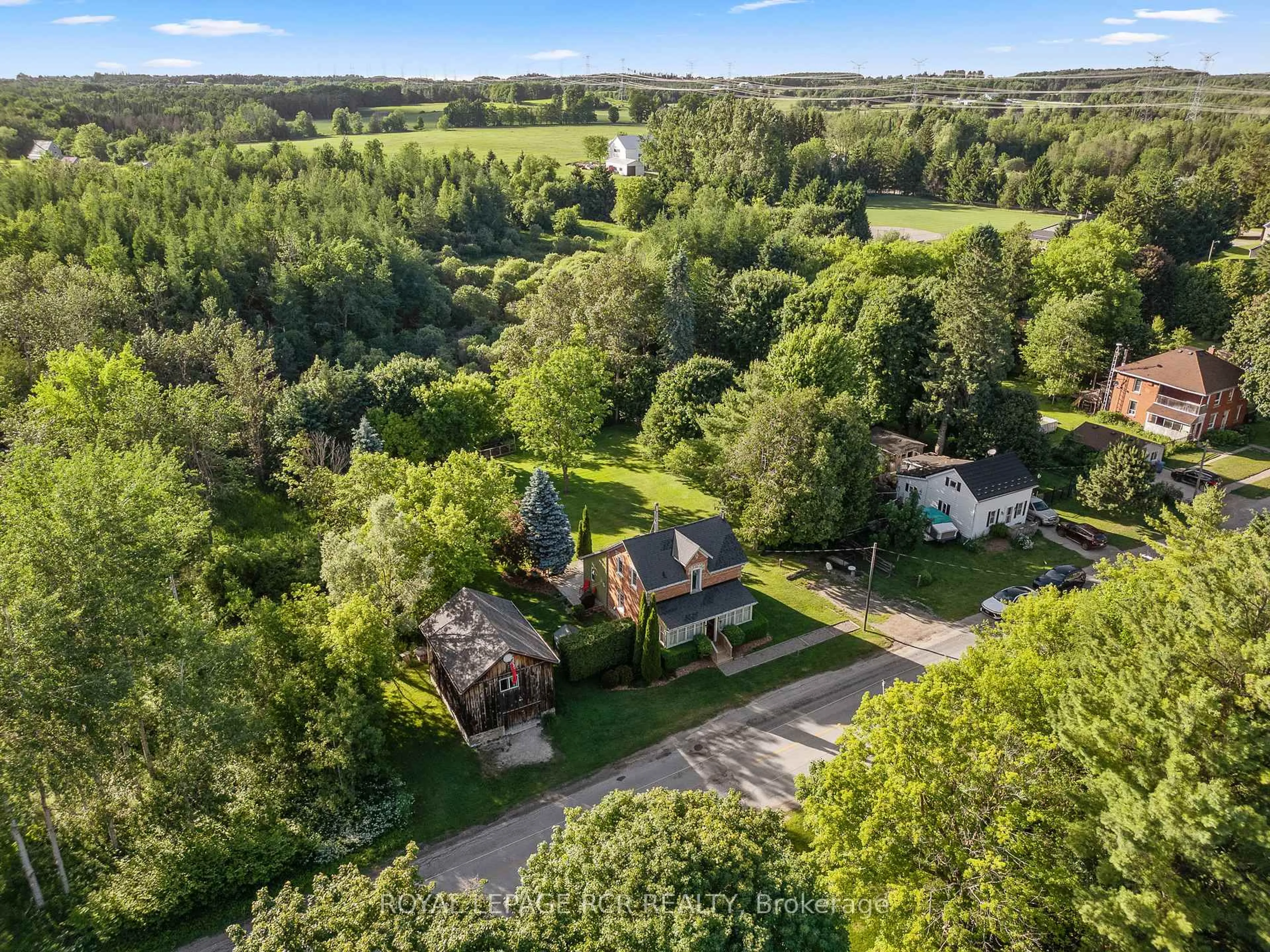 A pic from outside/outdoor area/front of a property/back of a property/a pic from drone, forest/trees view for 022021 E Gara-Erin Townline, East Garafraxa Ontario L9W 7G4