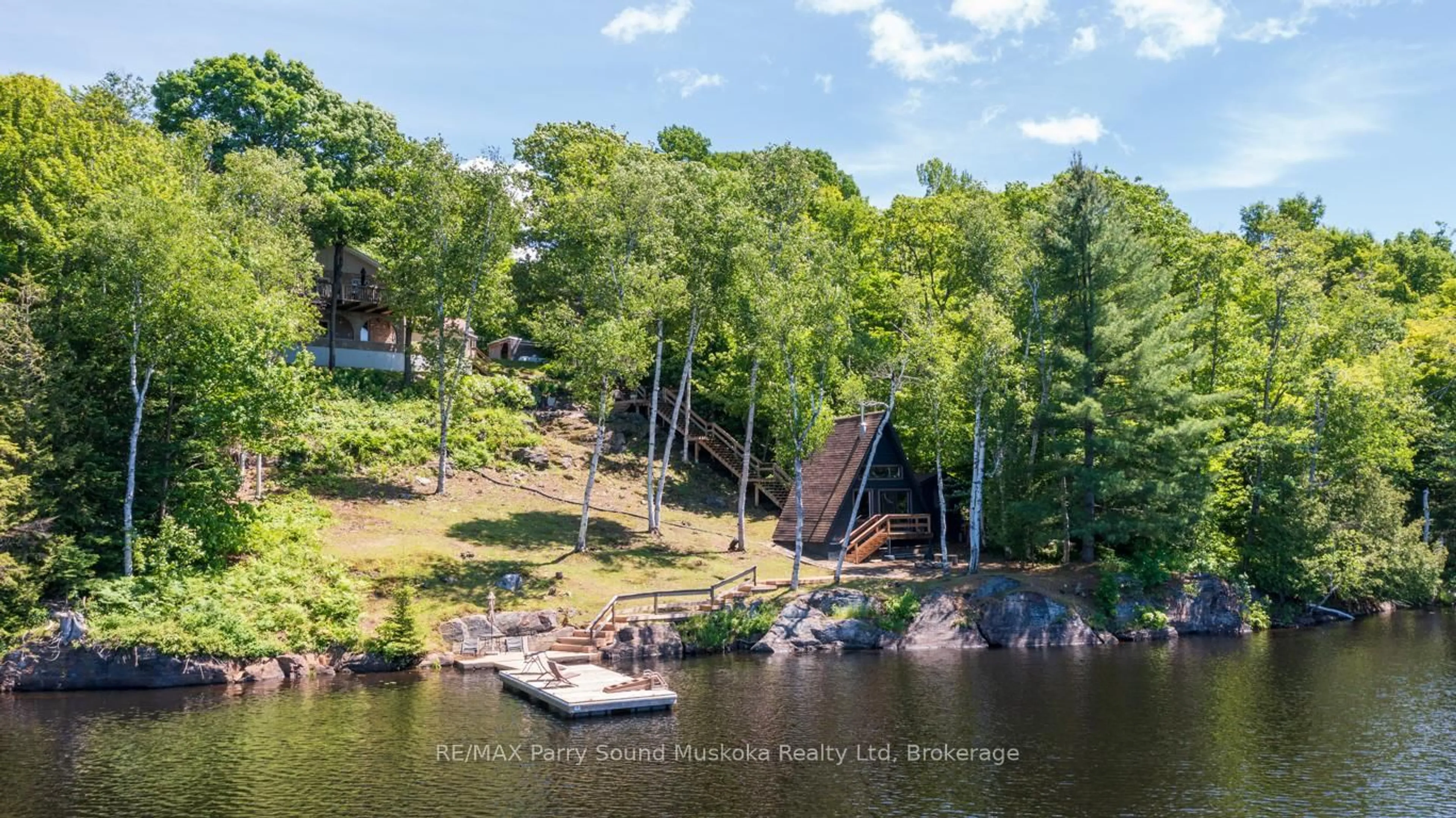 A pic from outside/outdoor area/front of a property/back of a property/a pic from drone, water/lake/river/ocean view for 40 Beaver Tr, McDougall Ontario P2A 2W7