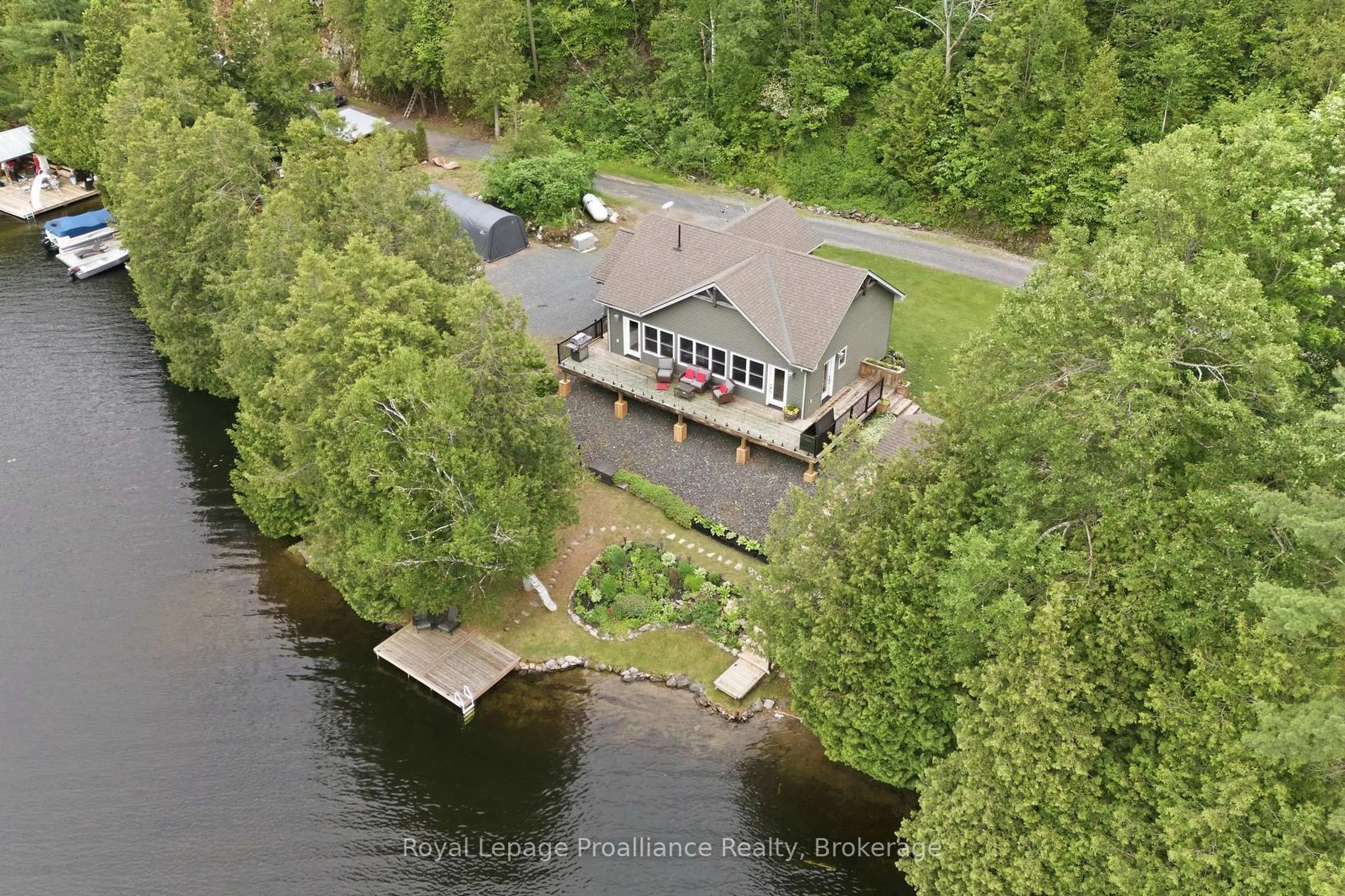 A pic from outside/outdoor area/front of a property/back of a property/a pic from drone, water/lake/river/ocean view for 1219 Silver Mine Lane, Arden Ontario K0H 1B0