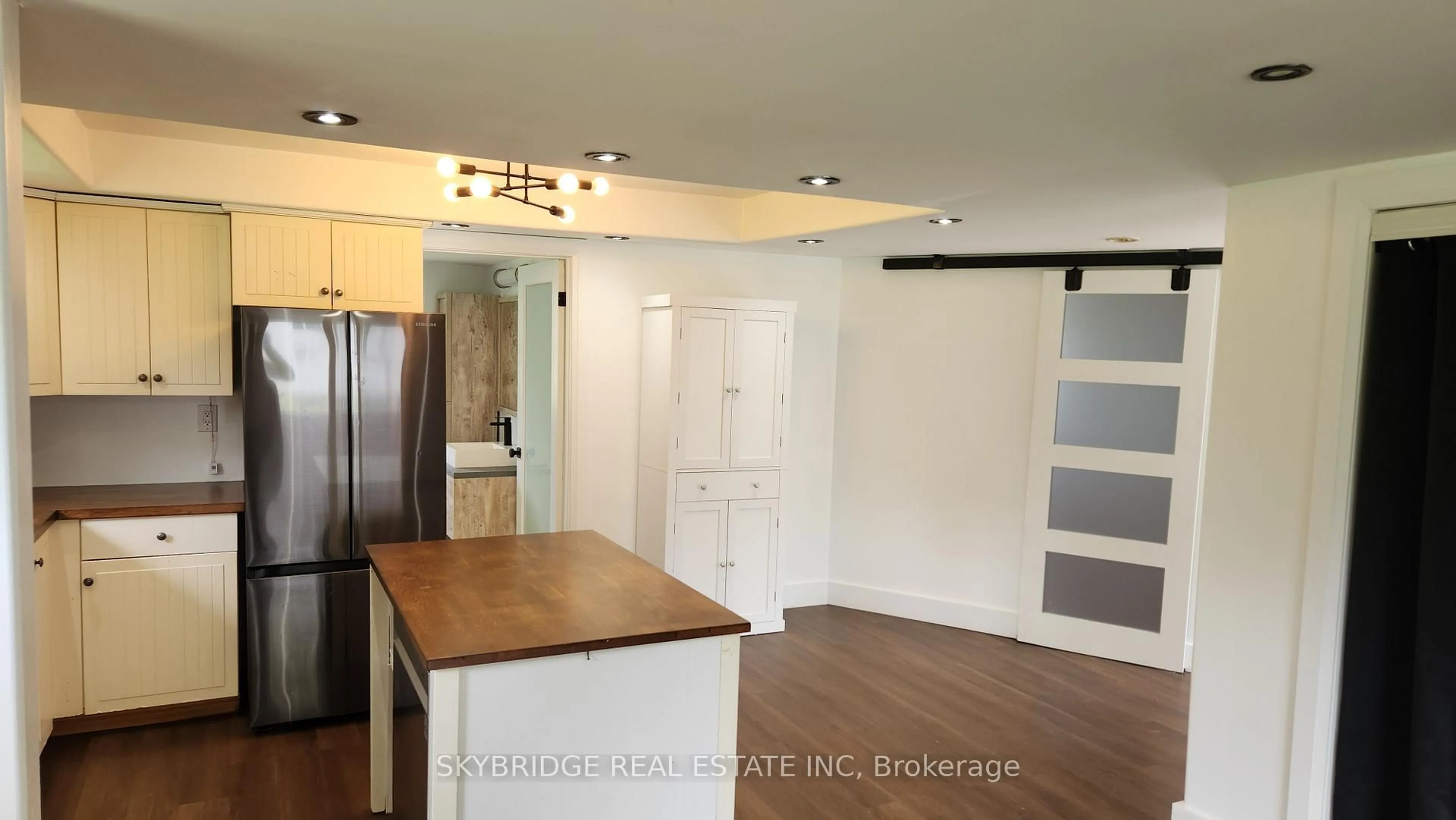 Open concept kitchen, wood/laminate floor for 12 Mohawk Line, Haldimand Ontario N0A 1K0