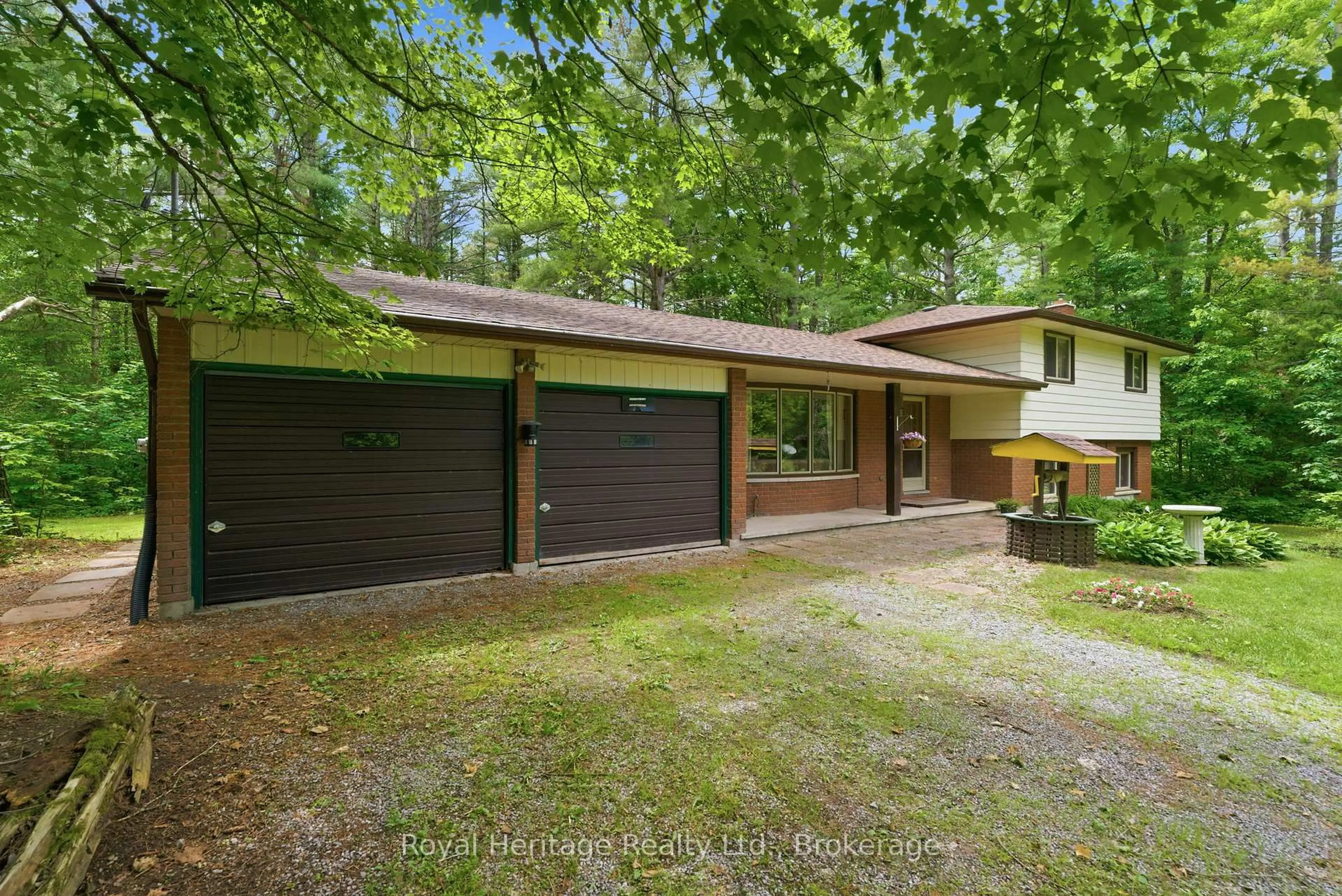 A pic from outside/outdoor area/front of a property/back of a property/a pic from drone, forest/trees view for 40 Melody Bay Rd, Trent Lakes Ontario K0L 1J0