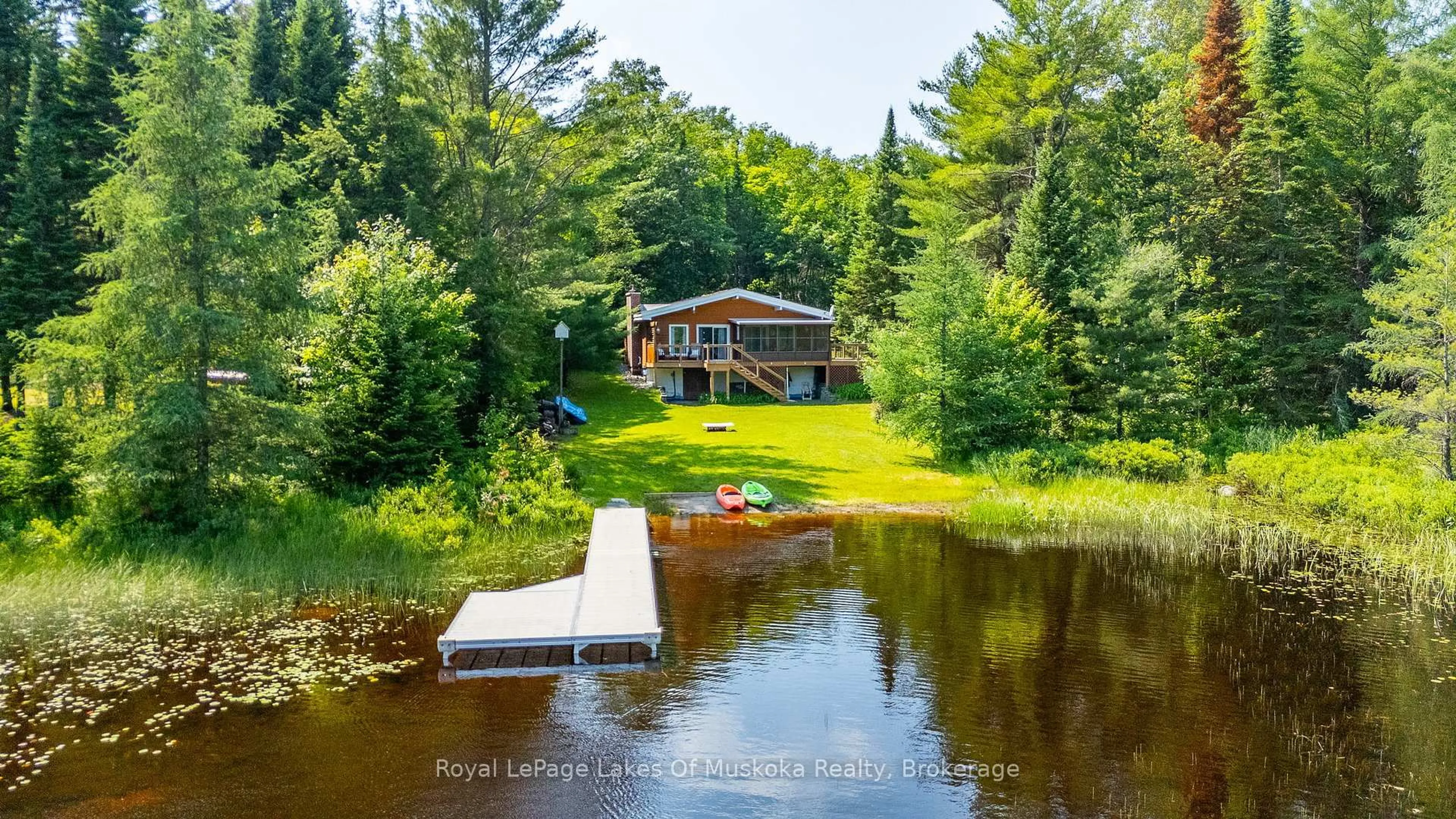 A pic from outside/outdoor area/front of a property/back of a property/a pic from drone, water/lake/river/ocean view for 1035 Atkins Lake Rd, Bracebridge Ontario P1L 1W9