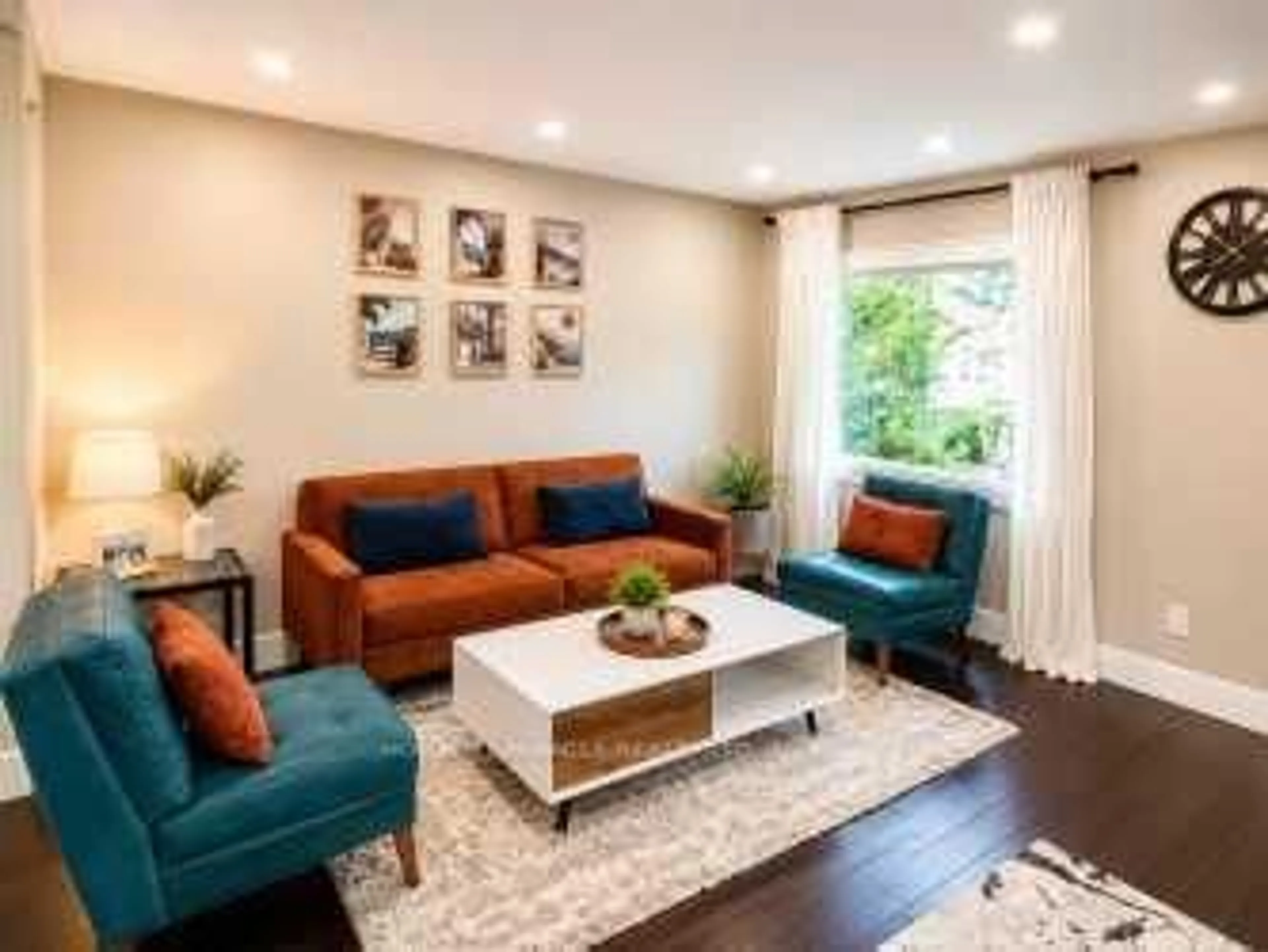 Living room with furniture, wood/laminate floor for 11 Reistview St, Kitchener Ontario N2E 4H1