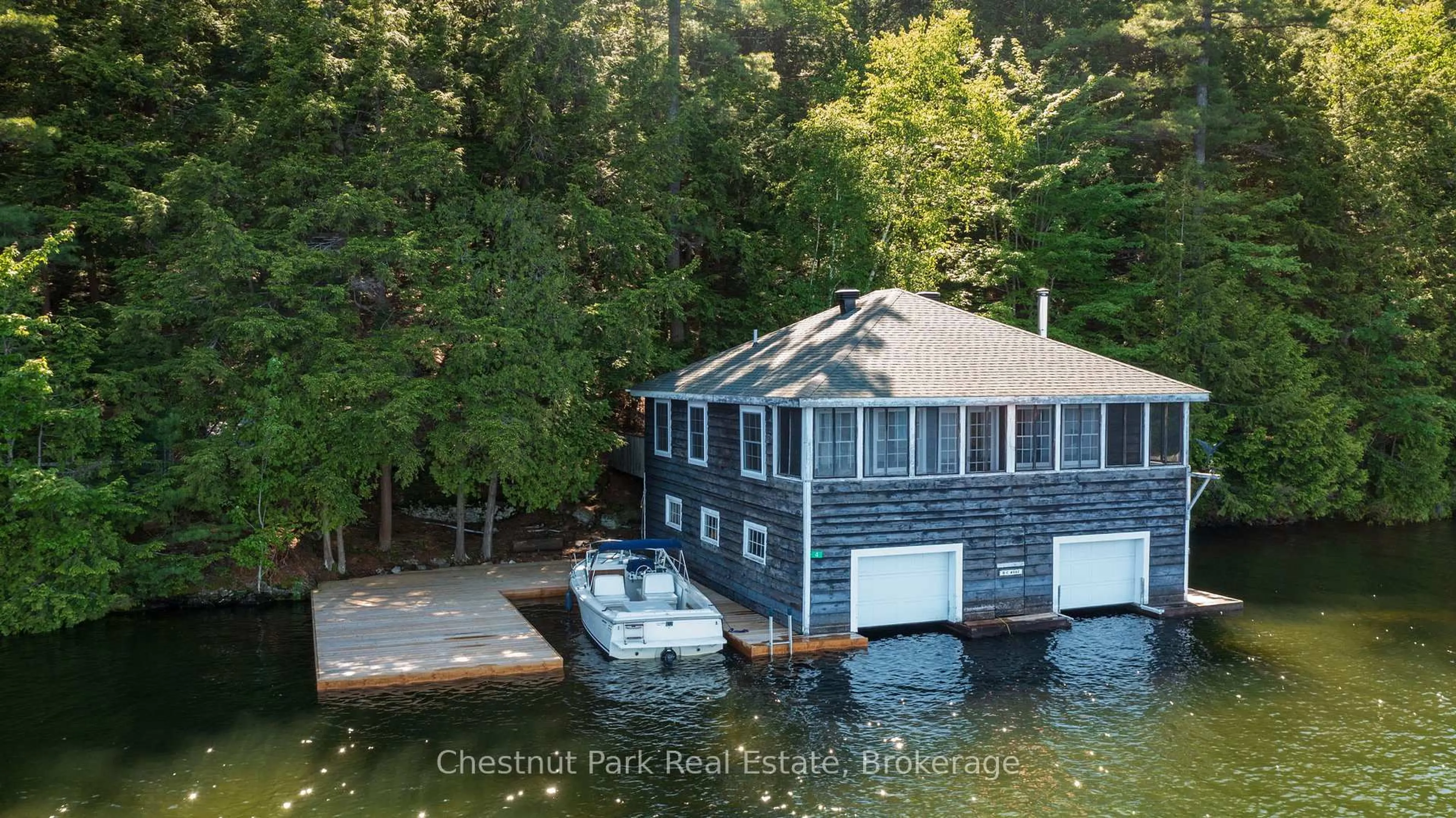 A pic from outside/outdoor area/front of a property/back of a property/a pic from drone, water/lake/river/ocean view for 4 Playfair Island # 3, Seguin Ontario P0C 1H0