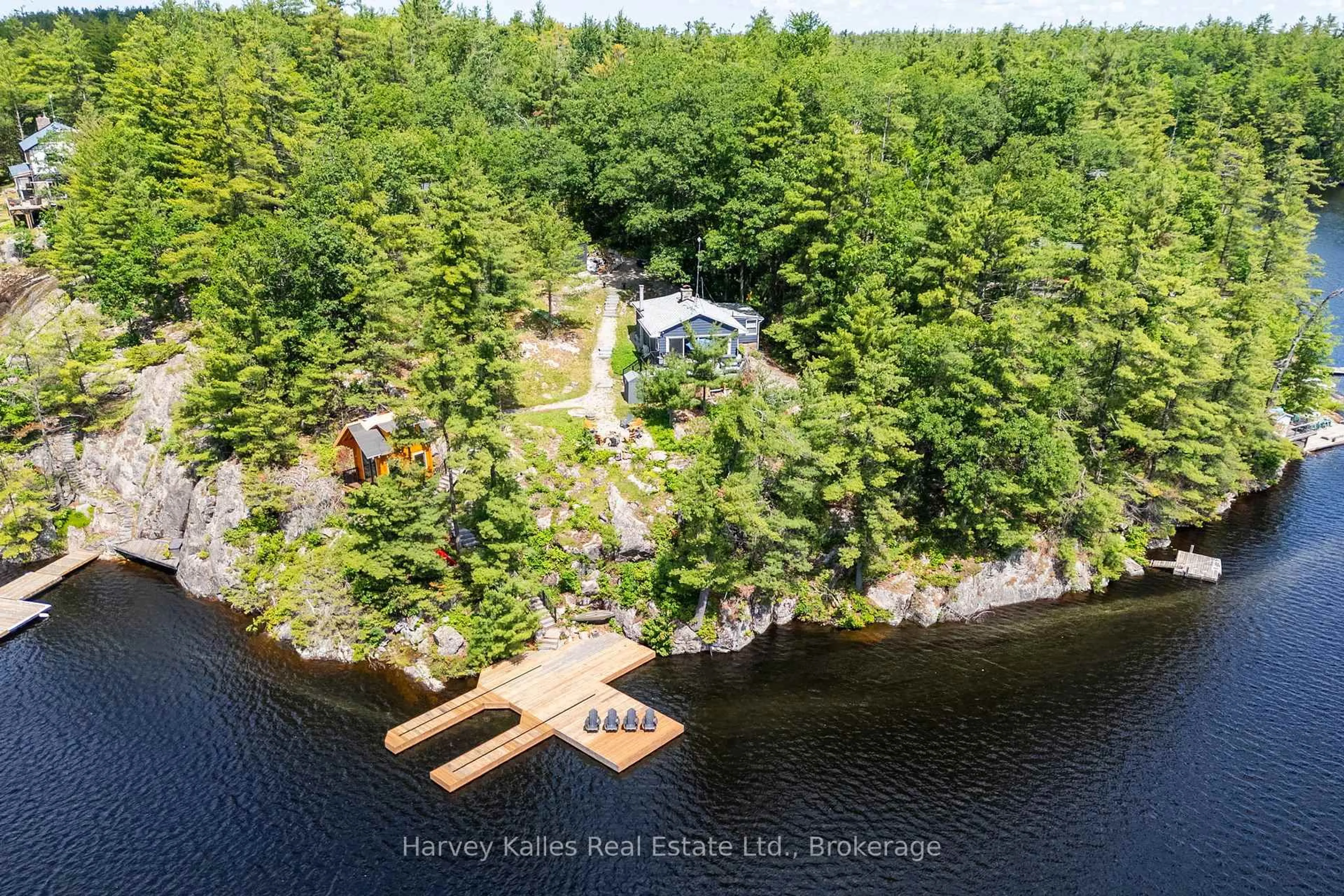 A pic from outside/outdoor area/front of a property/back of a property/a pic from drone, water/lake/river/ocean view for 1443 Silver Lake Rd, Gravenhurst Ontario P1P 0G3