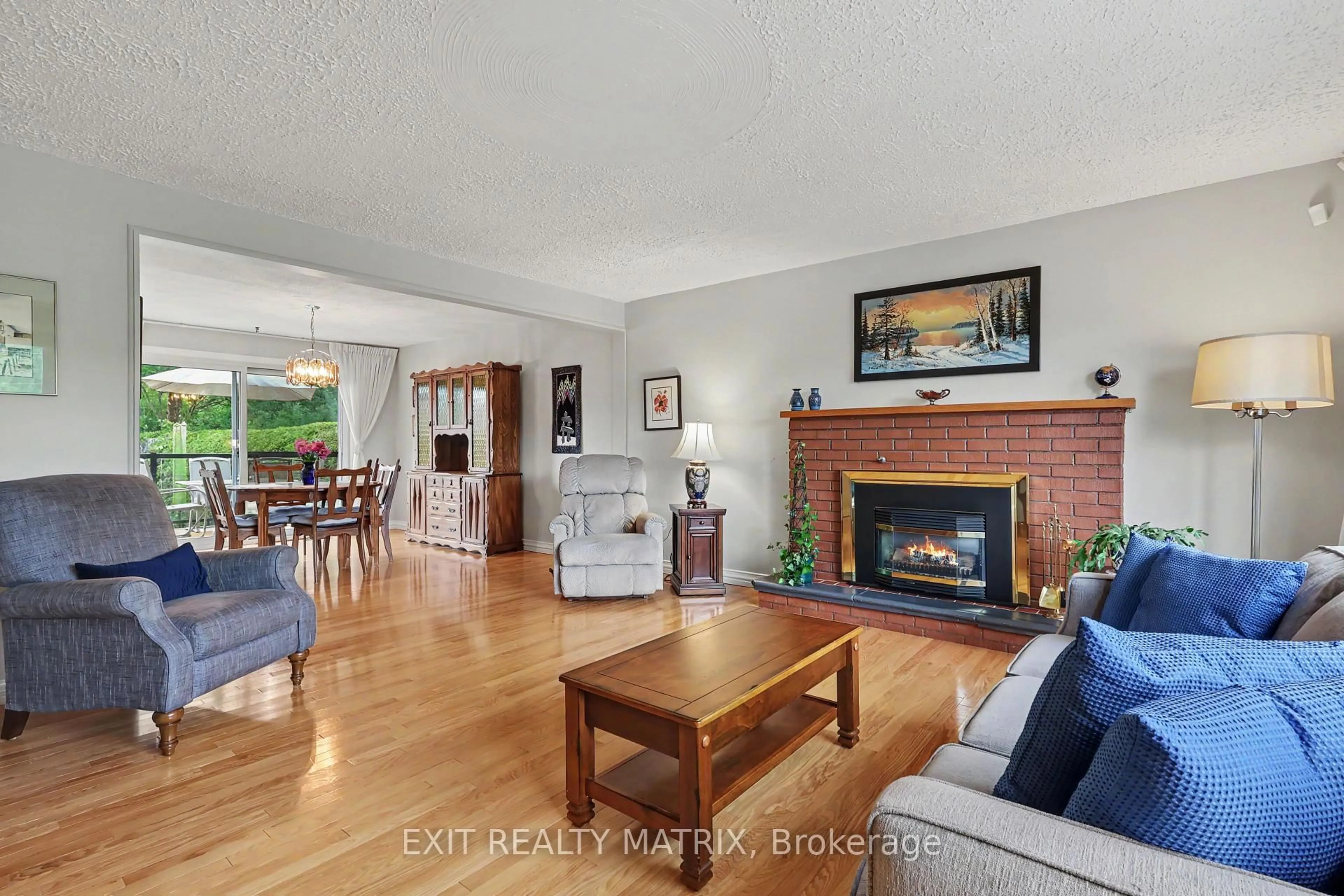 Living room with furniture, wood/laminate floor for 39 Tauvette St, Ottawa Ontario K1B 3A1