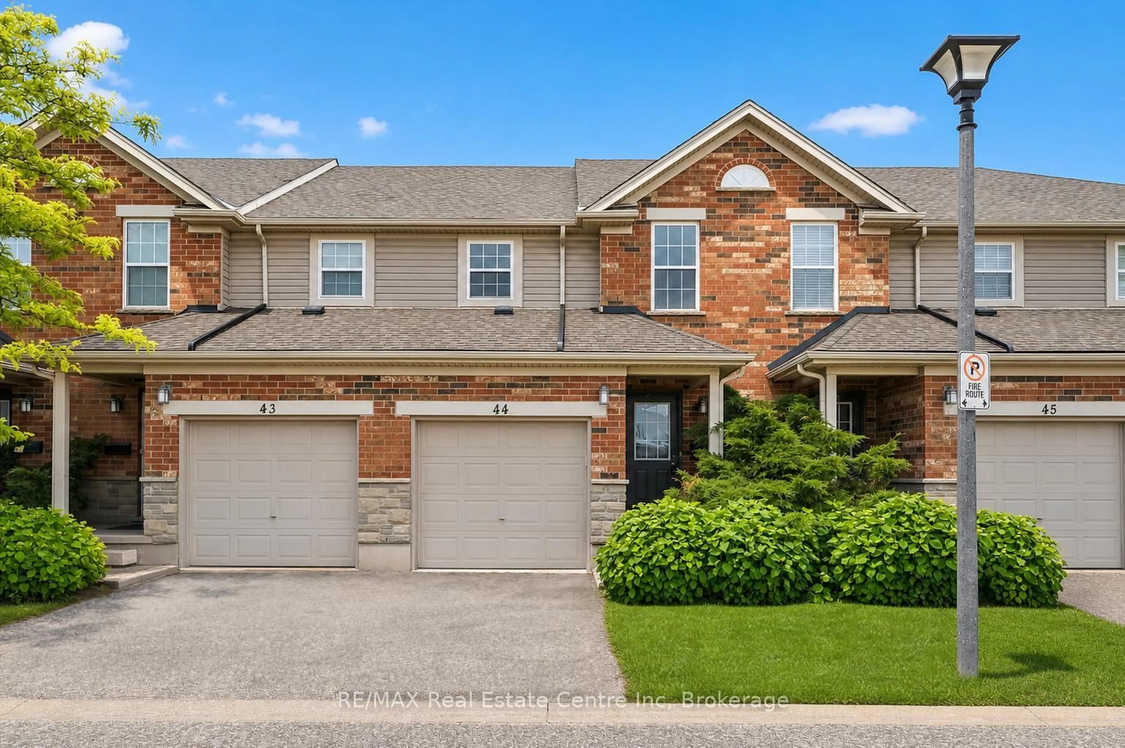 Home with brick exterior material, street for 124 GOSLING Gdns #44, Guelph Ontario N1G 5K6