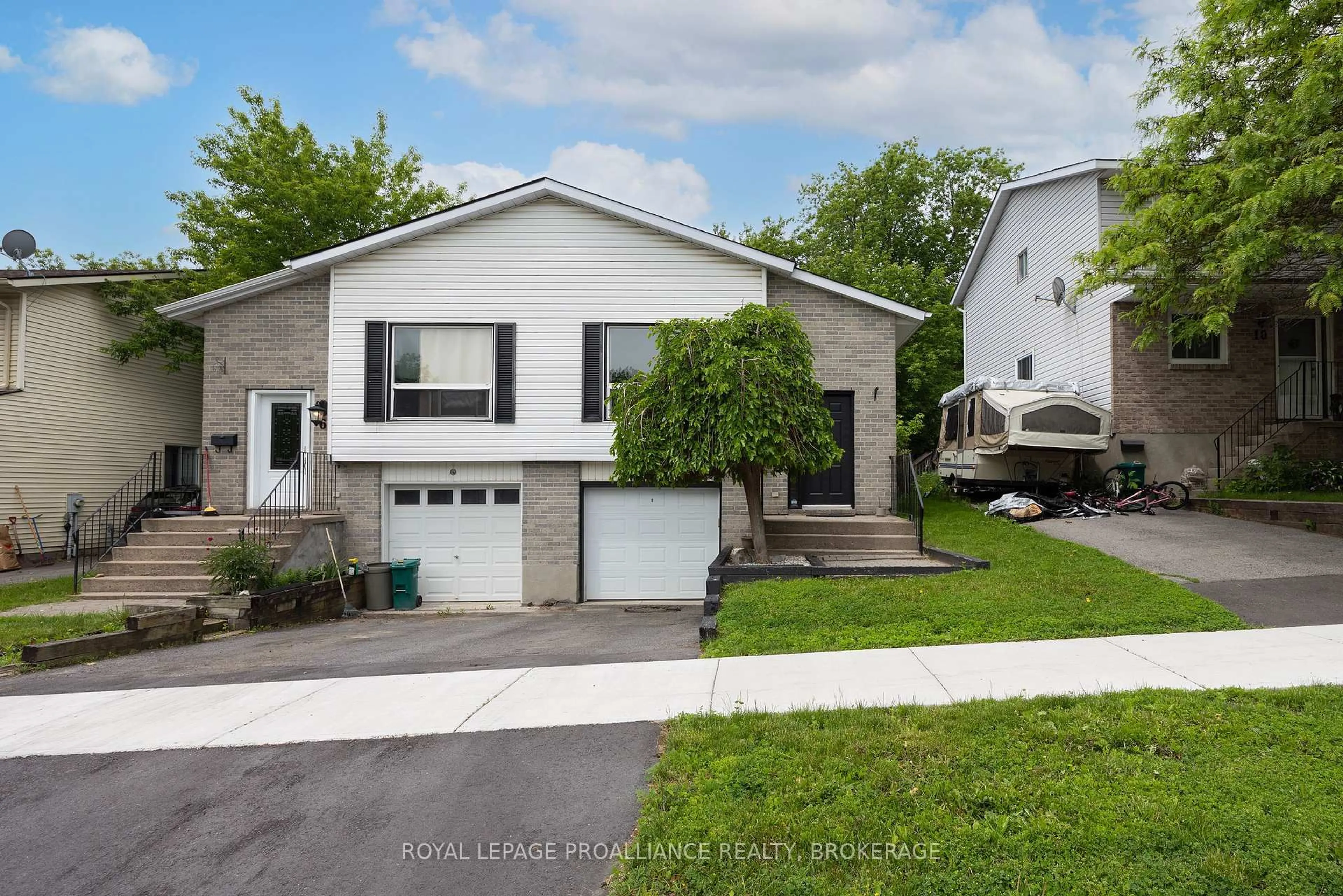 Home with vinyl exterior material, street for 8 Trillium Crt, Kingston Ontario K7K 6W9