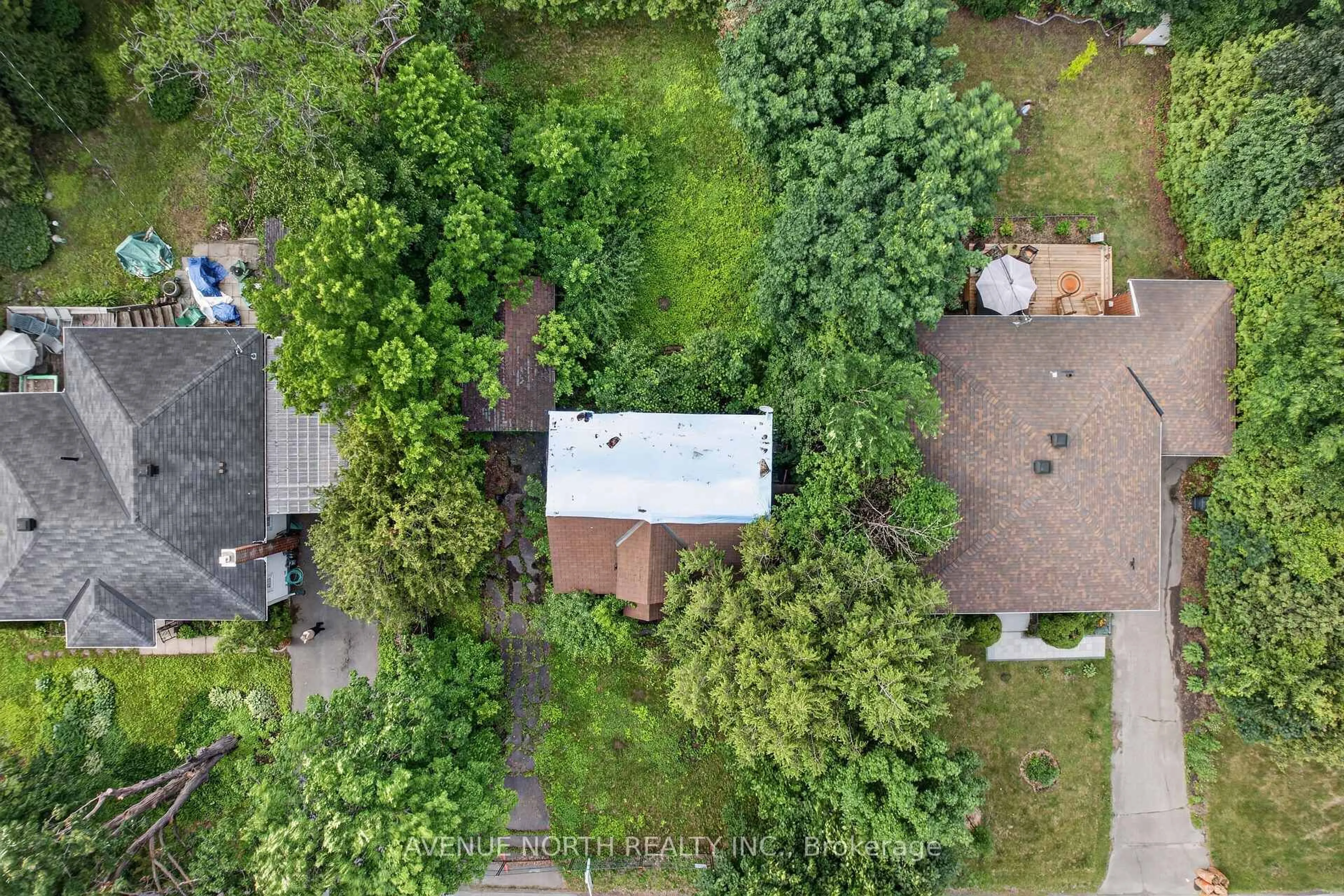 A pic from outside/outdoor area/front of a property/back of a property/a pic from drone, forest/trees view for 305 Mountbatten Ave, Ottawa Ontario K1H 5W2