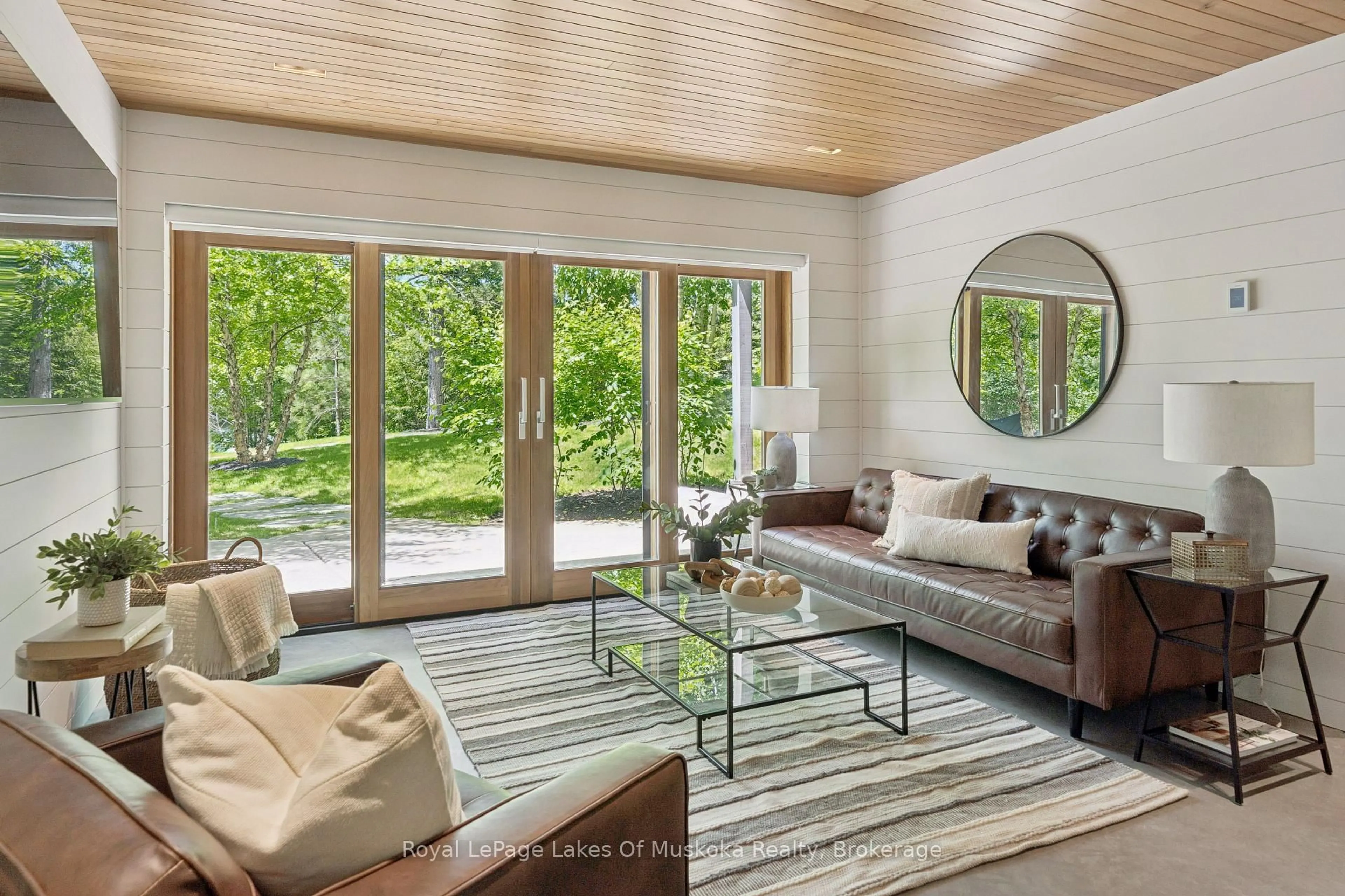 Living room with furniture, wood/laminate floor for 1016 Swift Lane, Algonquin Highlands Ontario P0A 1E0